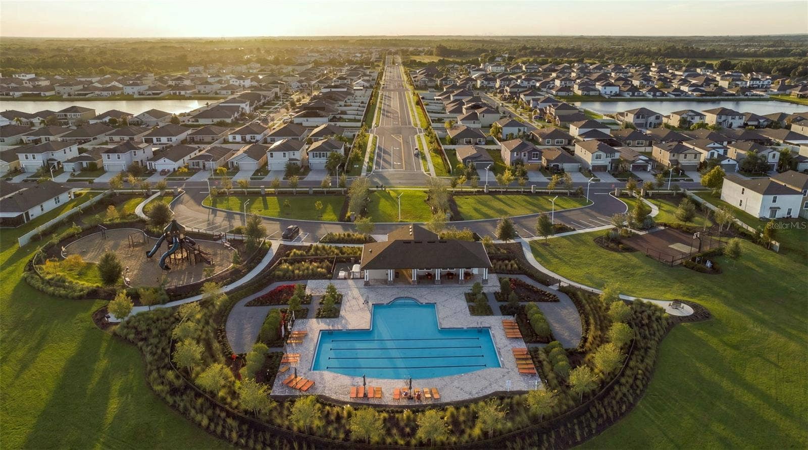 Overall view of pool, clubhouse, playground and basketball court