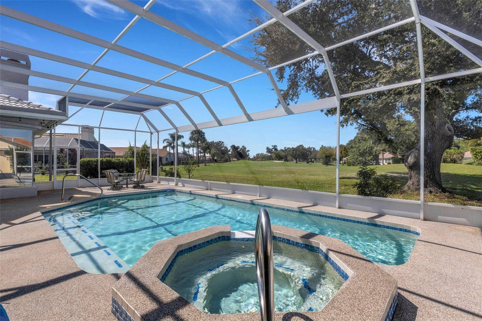 4806 PERIDIA BOULEVARD E, Bradenton, FL 34203 Pool and hot tub looking out to 8th Tee