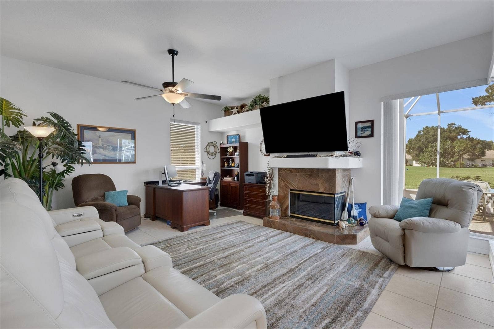4806 PERIDIA BOULEVARD E, Bradenton, FL 34203 Family room with view of golf course and pool