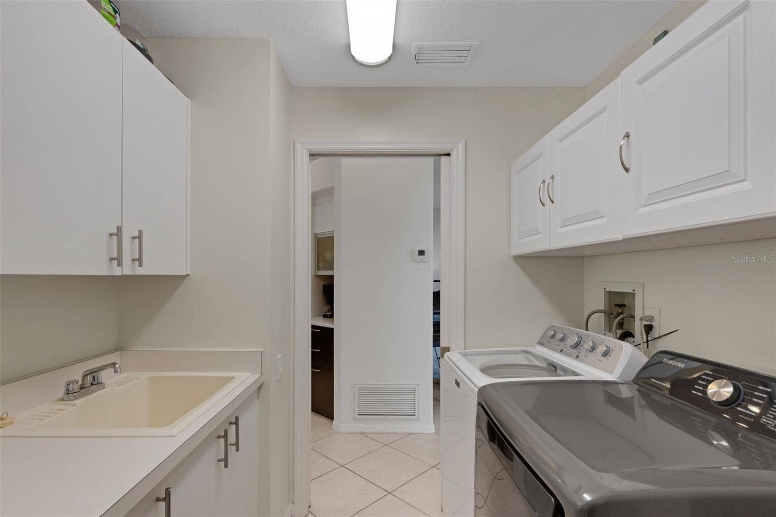 4806 PERIDIA BOULEVARD E, Bradenton, FL 34203 Laundry room with sink and countertop