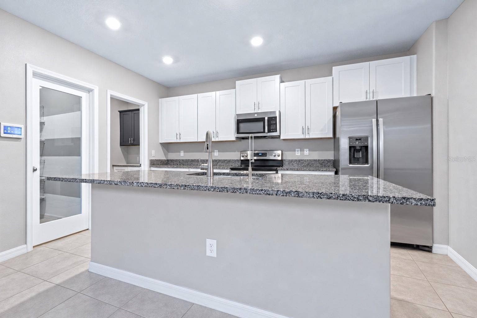 16755 DELIA STREET, Wimauma, FL 33598 Kitchen with walk in pantry