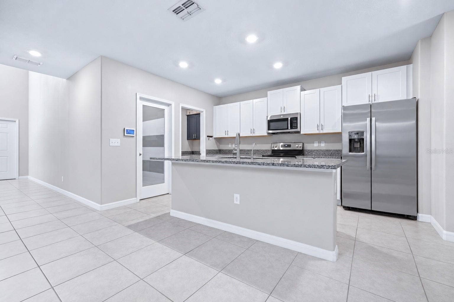 16755 DELIA STREET, Wimauma, FL 33598 Kitchen with walk in pantry