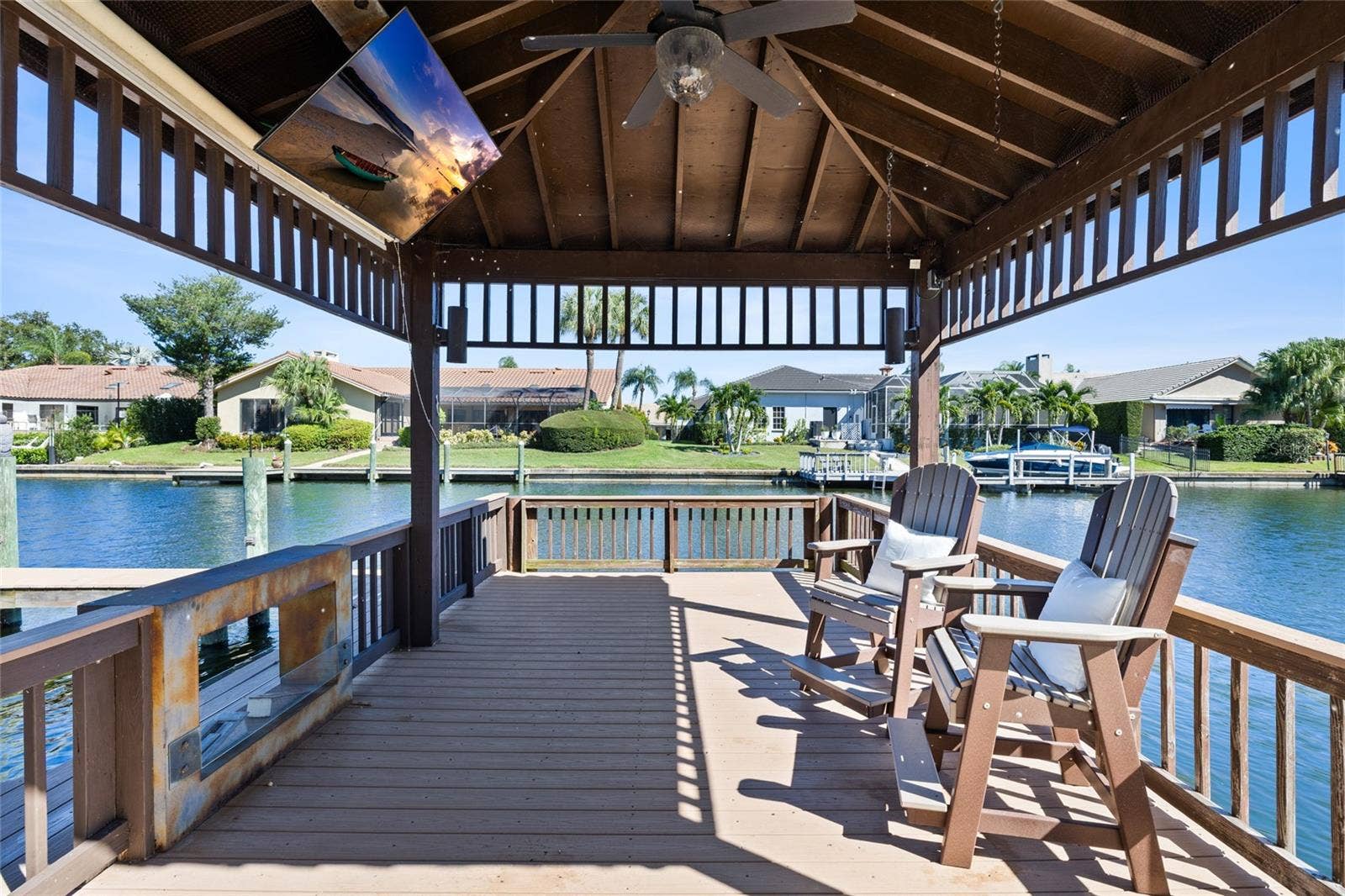 9805 COMPASS POINT WAY, Tampa, FL 33615 Covered dock space wth outdoor fireplace