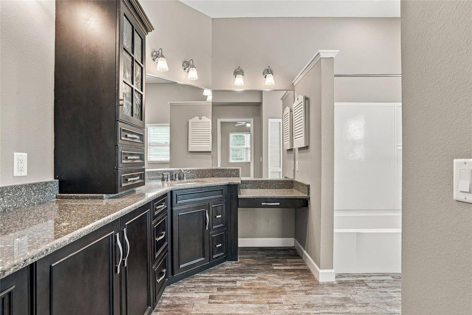 Updated bath with beautiful custom cabinetry