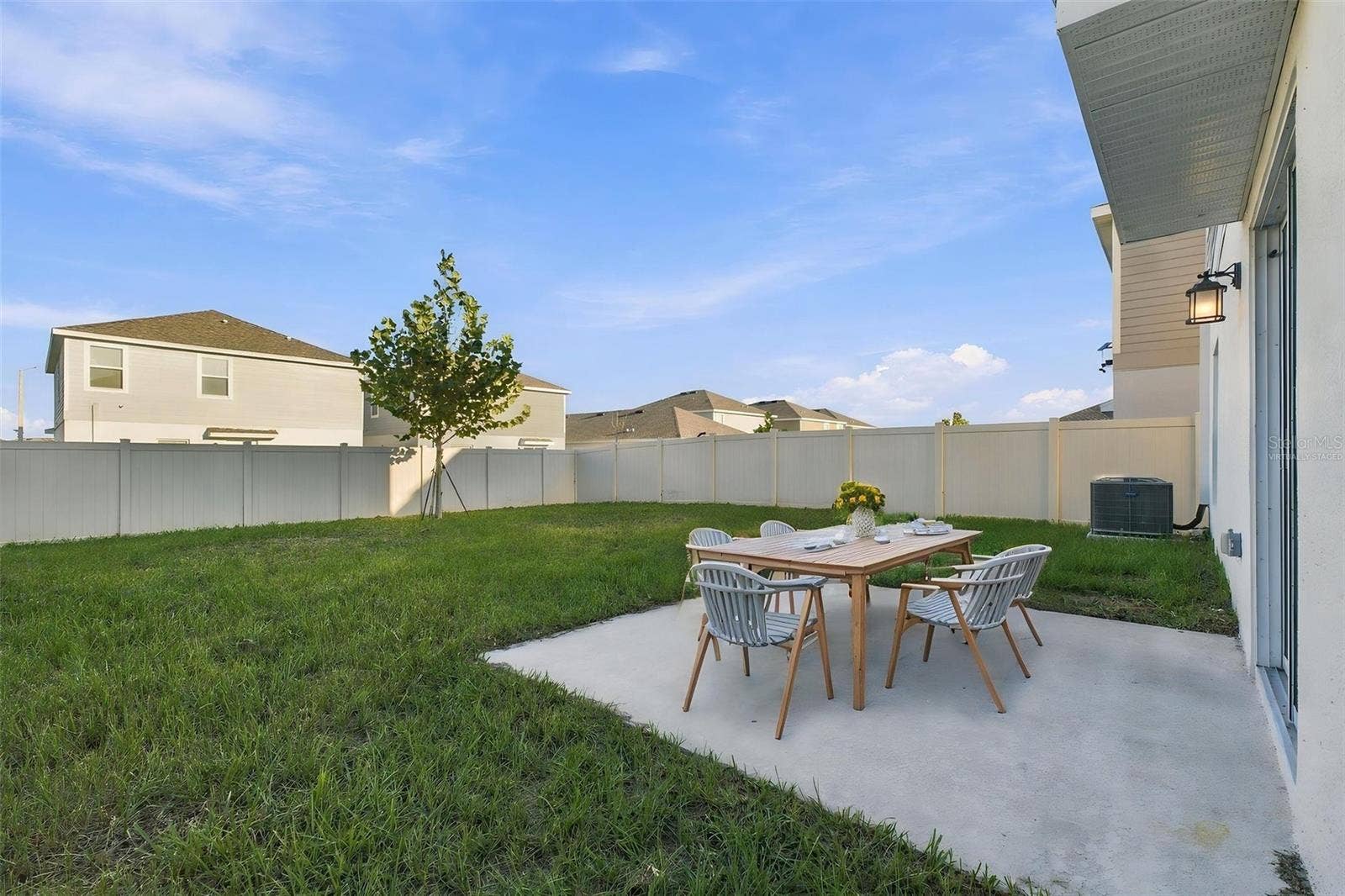 997 HAROLD PASS, Winter Haven, FL 33884 Back Patio and Fenced Yard - Virtually Staged