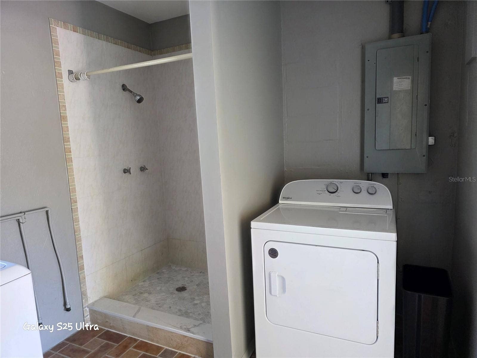 15601 ALMA AVENUE, Clearwater, FL 33760 Laundry room with fully functional shower