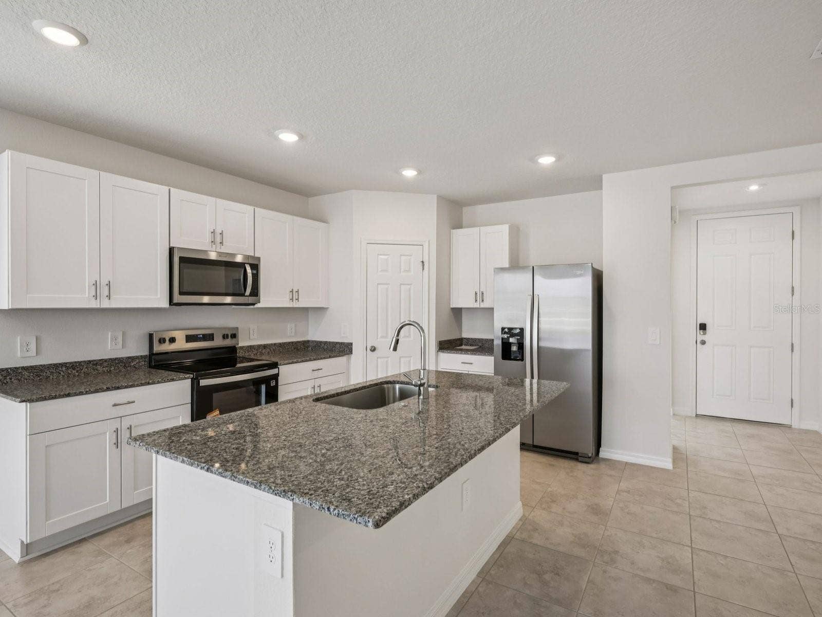 3965 GIORGIO DRIVE, Winter Haven, FL 33884 Can you make this description for VillaMar for MLS with a warm but sales appeal: This versatile floorplan offers four bedrooms, two full baths and family room, complemented by an open-concept kitchen, dining area, and great room designed for gathering and entertaining.