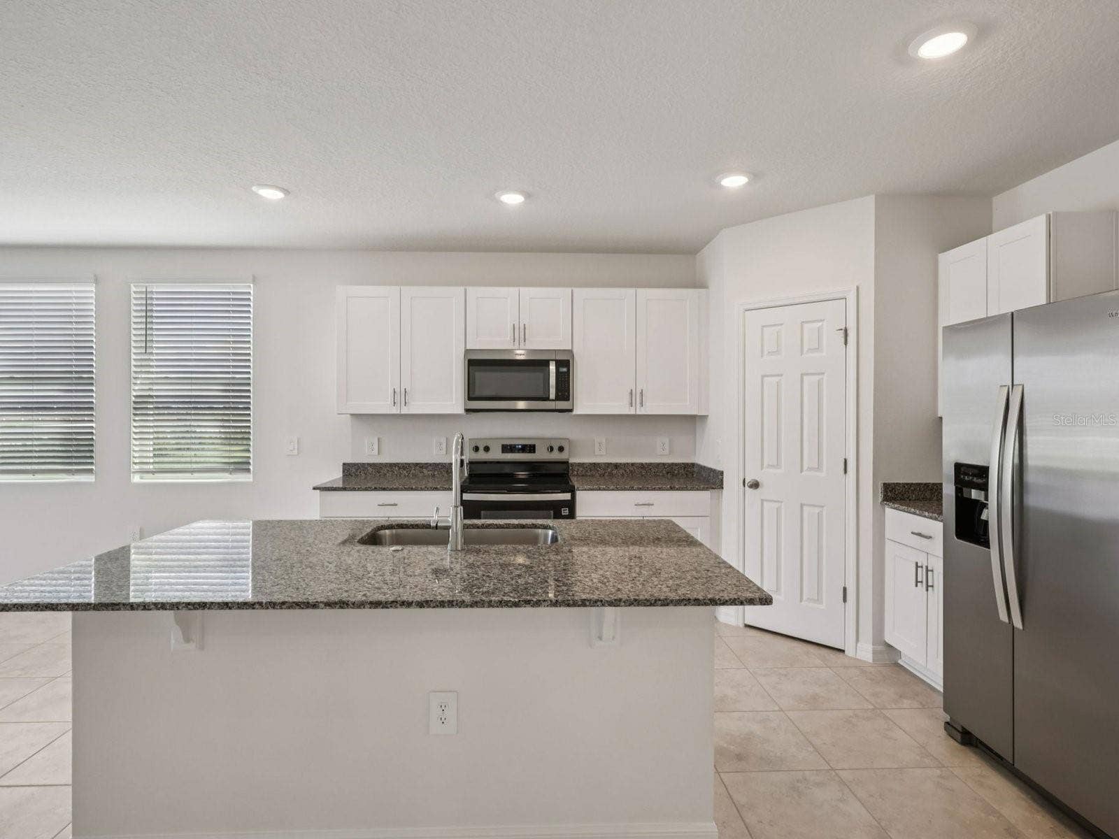 3965 GIORGIO DRIVE, Winter Haven, FL 33884 Can you make this description for VillaMar for MLS with a warm but sales appeal: This versatile floorplan offers four bedrooms, two full baths and family room, complemented by an open-concept kitchen, dining area, and great room designed for gathering and entertaining.
