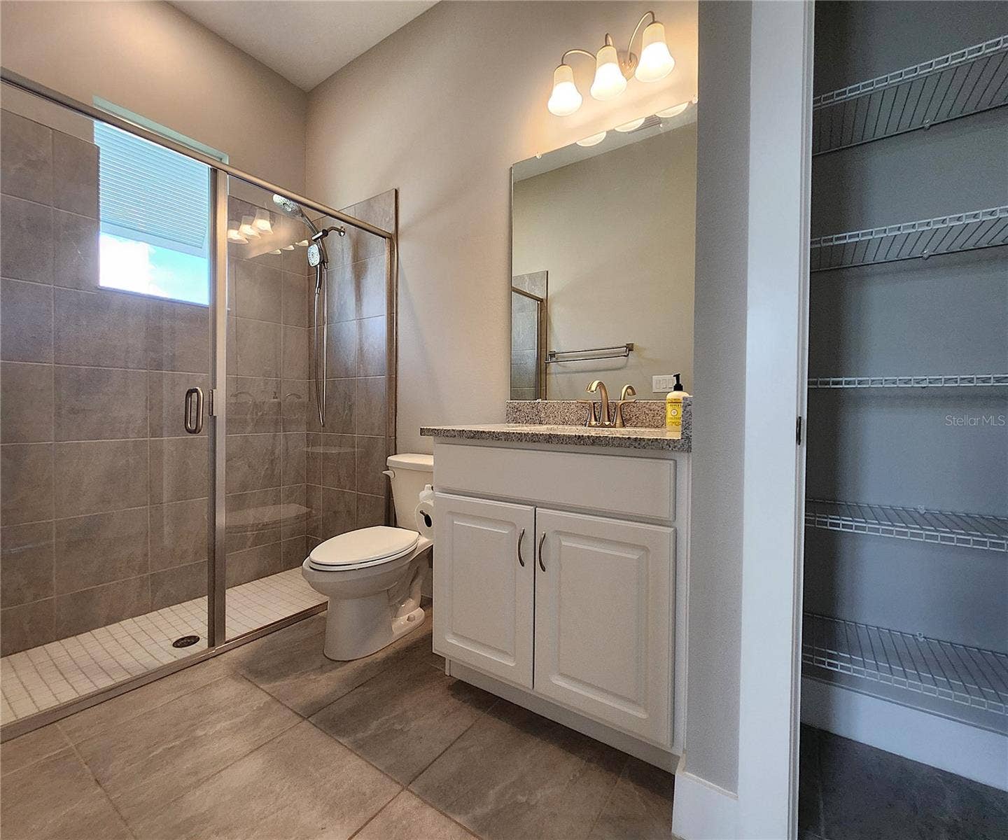 8896 DRUMMER PLANK DRIVE, Wesley Chapel, FL 33545 Guest House measures approximately 20x23, includes 1 bedroom, 1 full bathroom, living room, impact glass sliders with remote controlled shades.