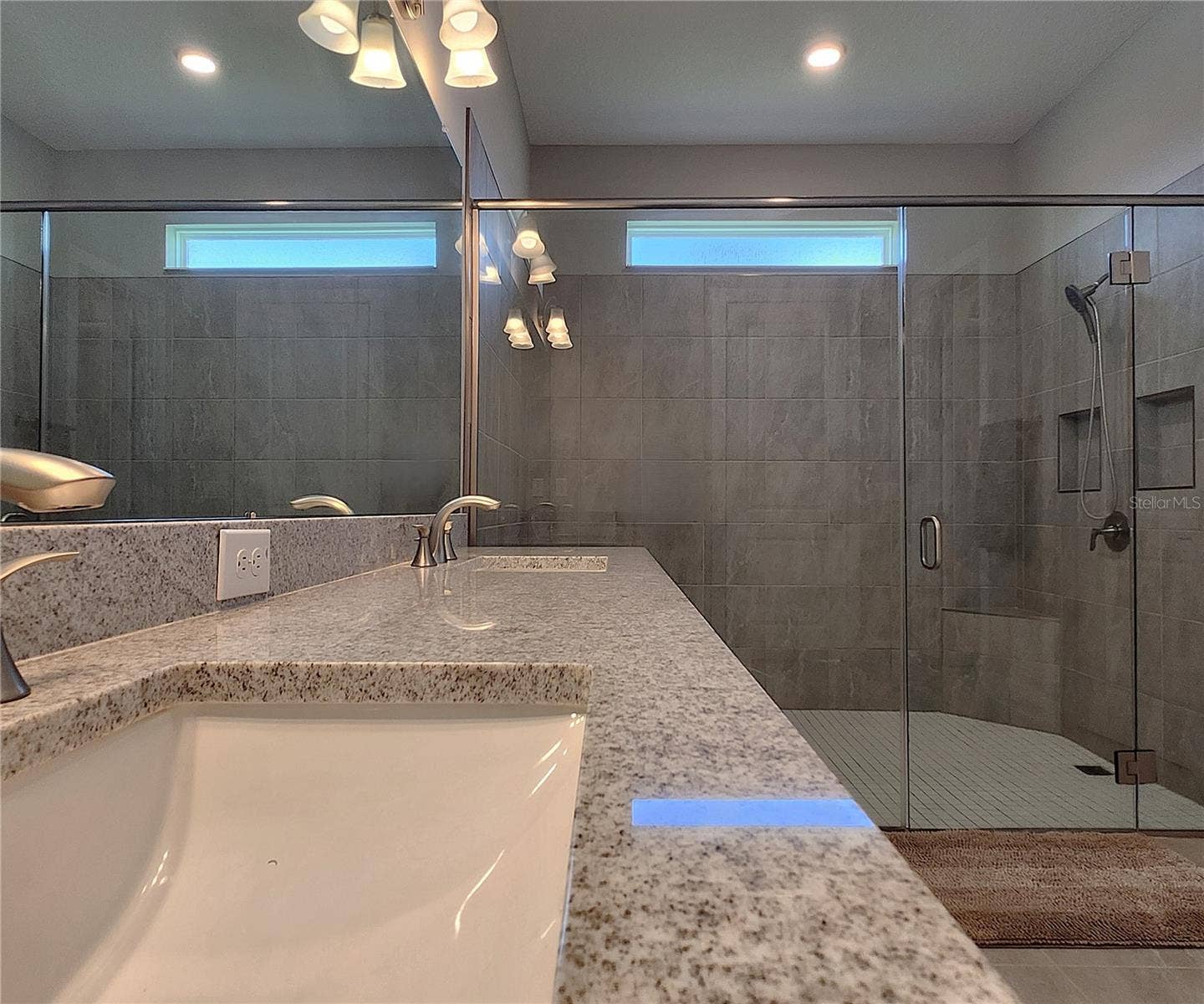 8896 DRUMMER PLANK DRIVE, Wesley Chapel, FL 33545 Master bathroom includes large walk-in tiled shower, water closet, walk-in closet, dual sink vanity, granite countertops
