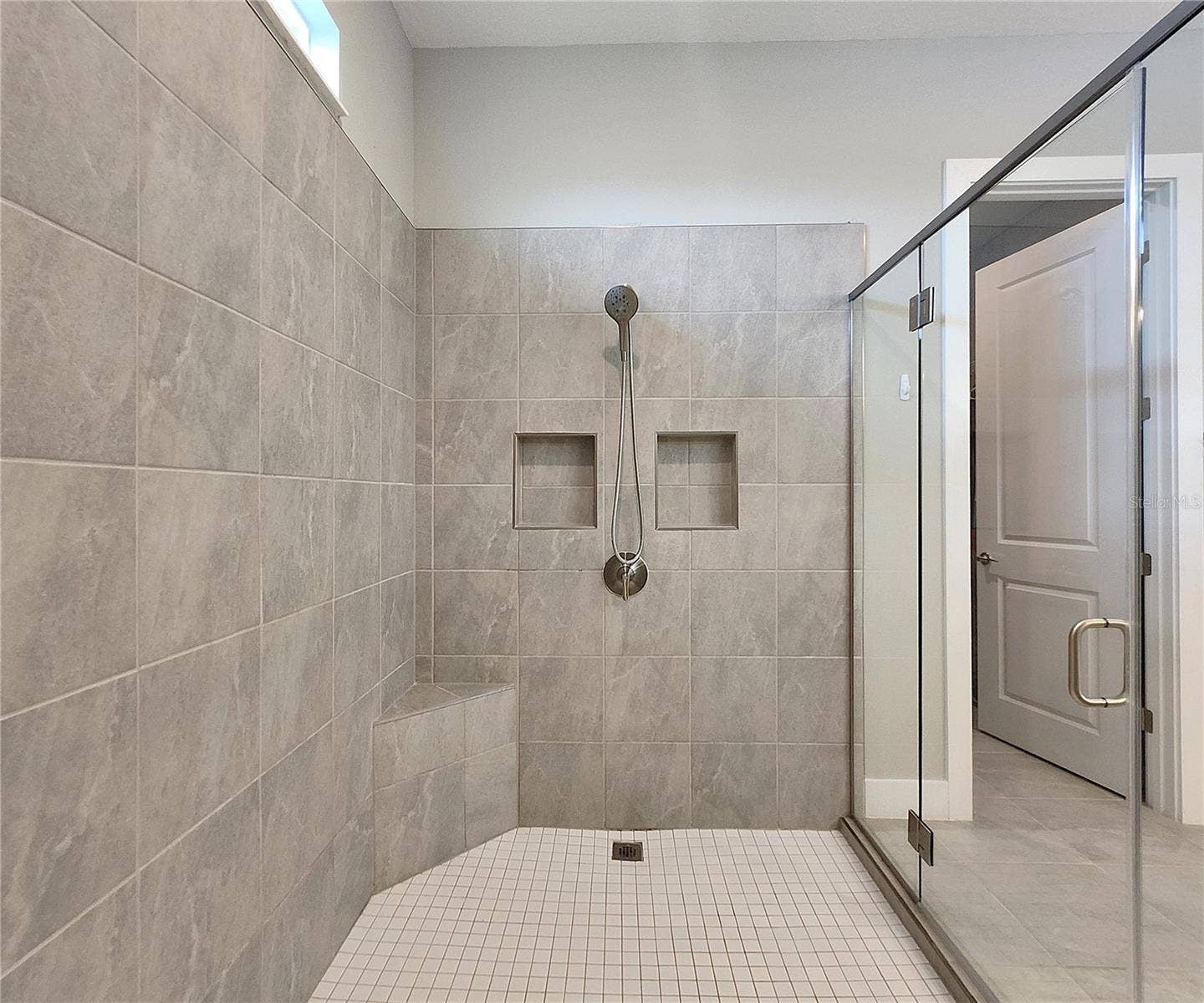 8896 DRUMMER PLANK DRIVE, Wesley Chapel, FL 33545 Master bathroom includes large walk-in tiled shower, water closet, walk-in closet, dual sink vanity, granite countertops