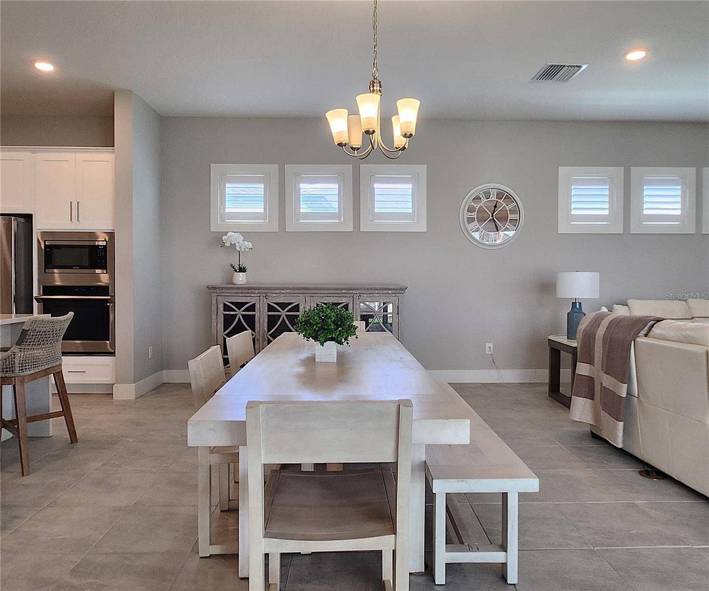 8896 DRUMMER PLANK DRIVE, Wesley Chapel, FL 33545 Main home: plantation shutters, remote controlled shade, large living room, dining area, large open kitchen, 3 bedrooms, 2 full bathrooms, 1 guest bathroom, interior laundry room