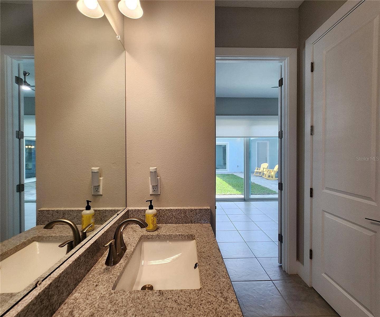 8896 DRUMMER PLANK DRIVE, Wesley Chapel, FL 33545 Guest House measures approximately 20x23, includes 1 bedroom, 1 full bathroom, living room, impact glass sliders with remote controlled shades.