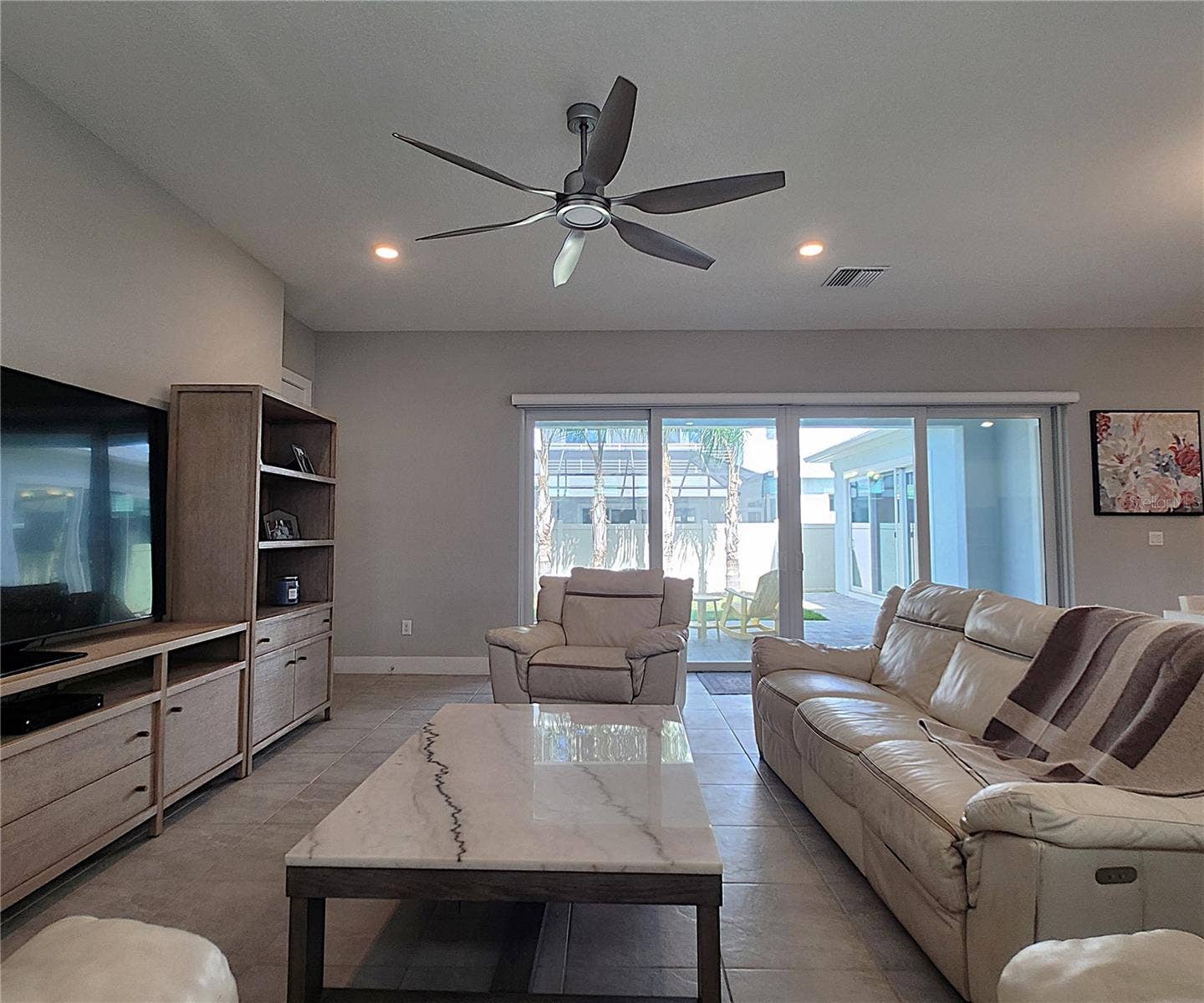 8896 DRUMMER PLANK DRIVE, Wesley Chapel, FL 33545 Main home: plantation shutters, remote controlled shade, large living room, dining area, large open kitchen, 3 bedrooms, 2 full bathrooms, 1 guest bathroom, interior laundry room