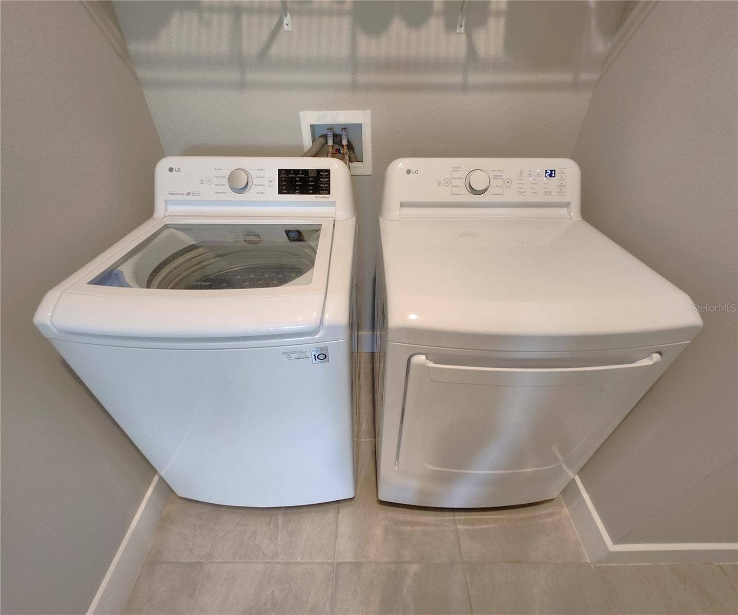 8896 DRUMMER PLANK DRIVE, Wesley Chapel, FL 33545 Interior Laundry Room includes side-by-side washer and dryer, ventilated shelves, and storage space