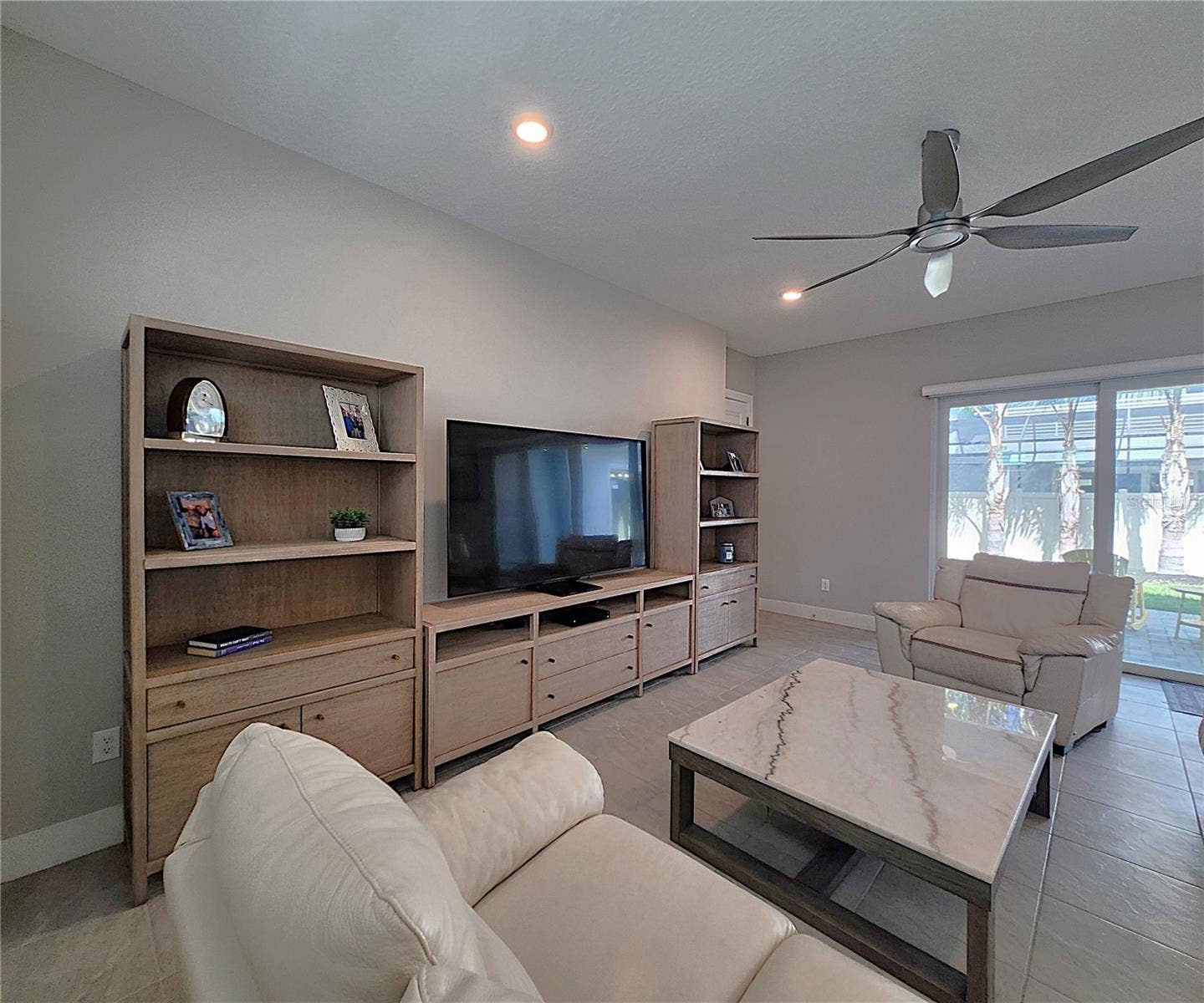 8896 DRUMMER PLANK DRIVE, Wesley Chapel, FL 33545 Main home: plantation shutters, remote controlled shade, large living room, dining area, large open kitchen, 3 bedrooms, 2 full bathrooms, 1 guest bathroom, interior laundry room