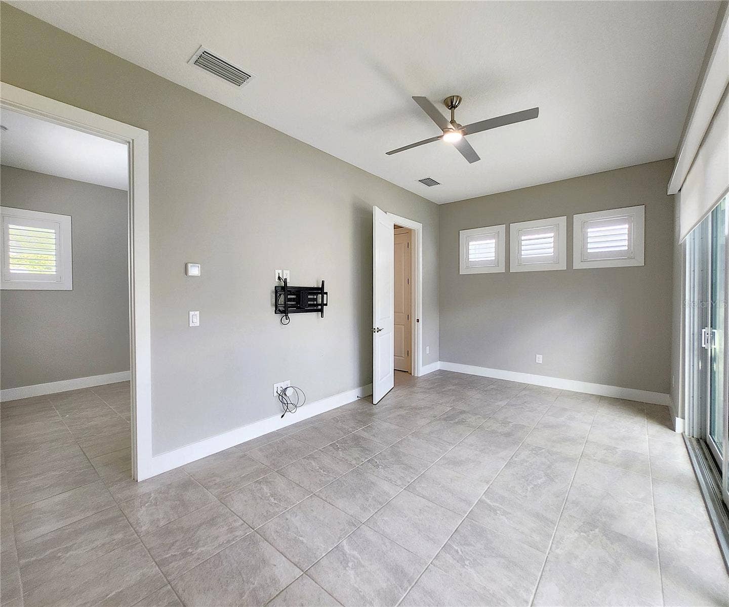 8896 DRUMMER PLANK DRIVE, Wesley Chapel, FL 33545 Guest House measures approximately 20x23, includes 1 bedroom, 1 full bathroom, living room, impact glass sliders with remote controlled shades.