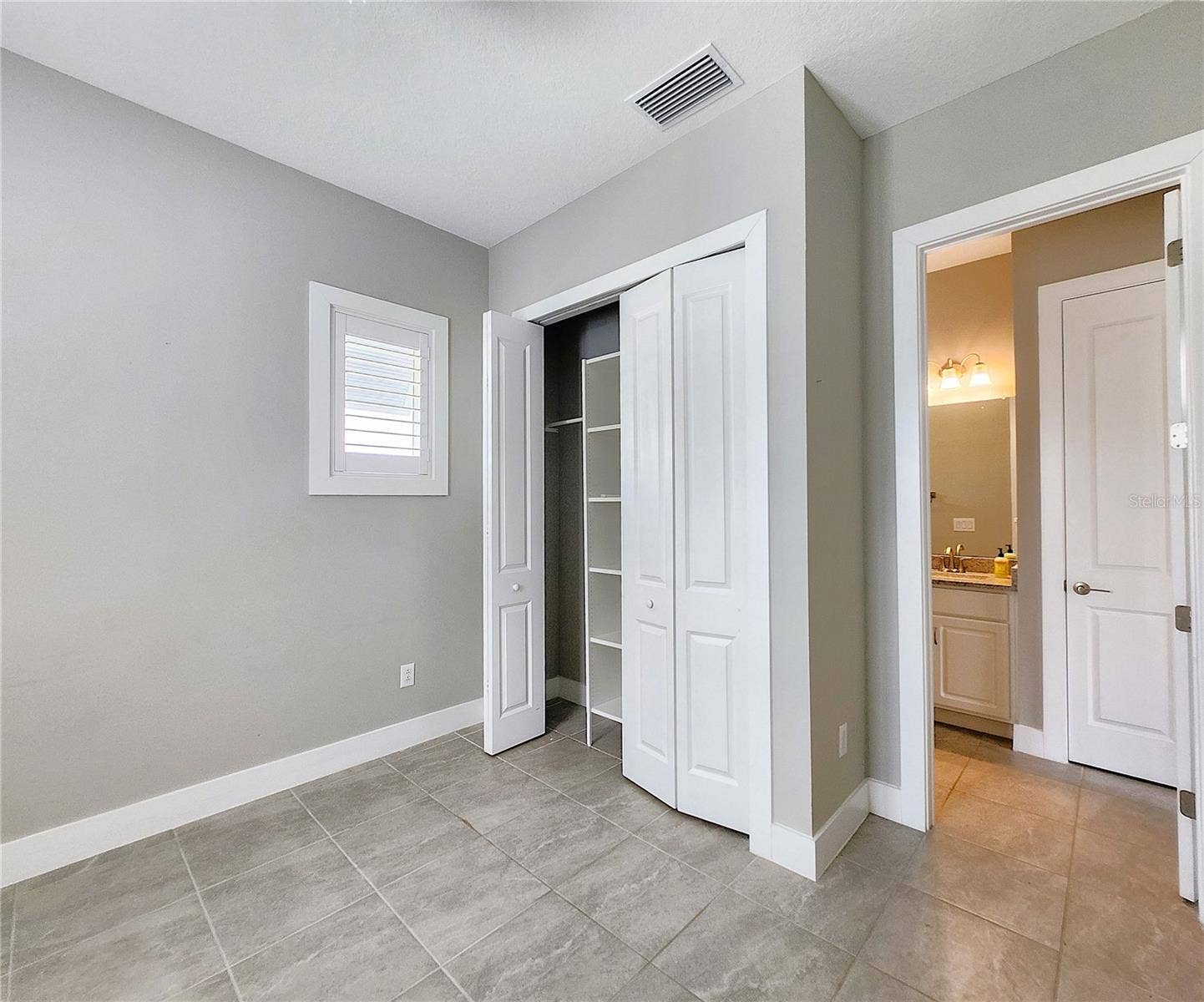 8896 DRUMMER PLANK DRIVE, Wesley Chapel, FL 33545 Guest House measures approximately 20x23, includes 1 bedroom, 1 full bathroom, living room, impact glass sliders with remote controlled shades.