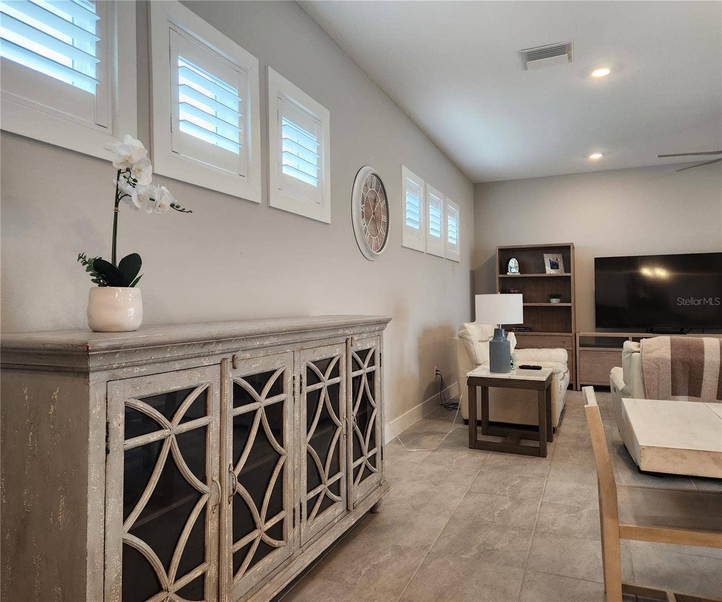 8896 DRUMMER PLANK DRIVE, Wesley Chapel, FL 33545 Main home: plantation shutters, remote controlled shade, large living room, dining area, large open kitchen, 3 bedrooms, 2 full bathrooms, 1 guest bathroom, interior laundry room