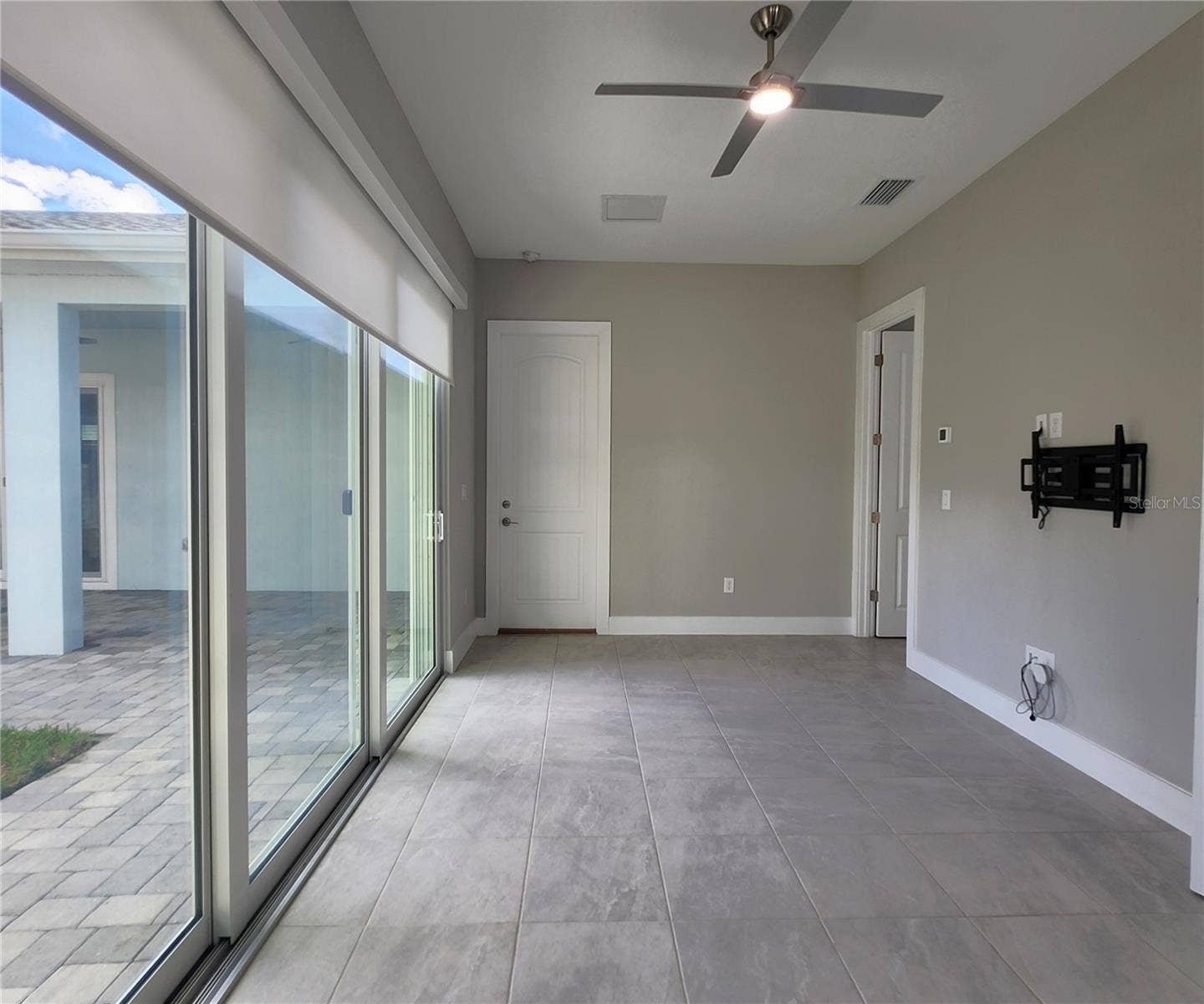 8896 DRUMMER PLANK DRIVE, Wesley Chapel, FL 33545 Guest House measures approximately 20x23, includes 1 bedroom, 1 full bathroom, living room, impact glass sliders with remote controlled shades.