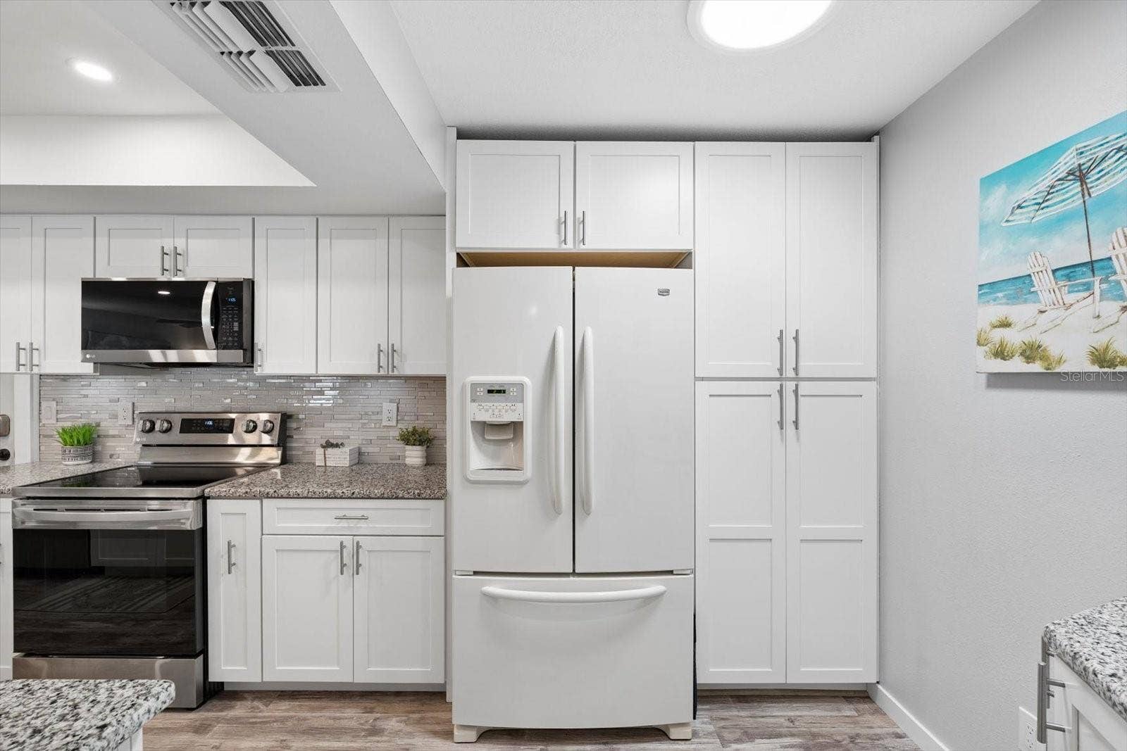 Plenty of storage space and countertops, recessed lighting and solar tube for energy effienciency.