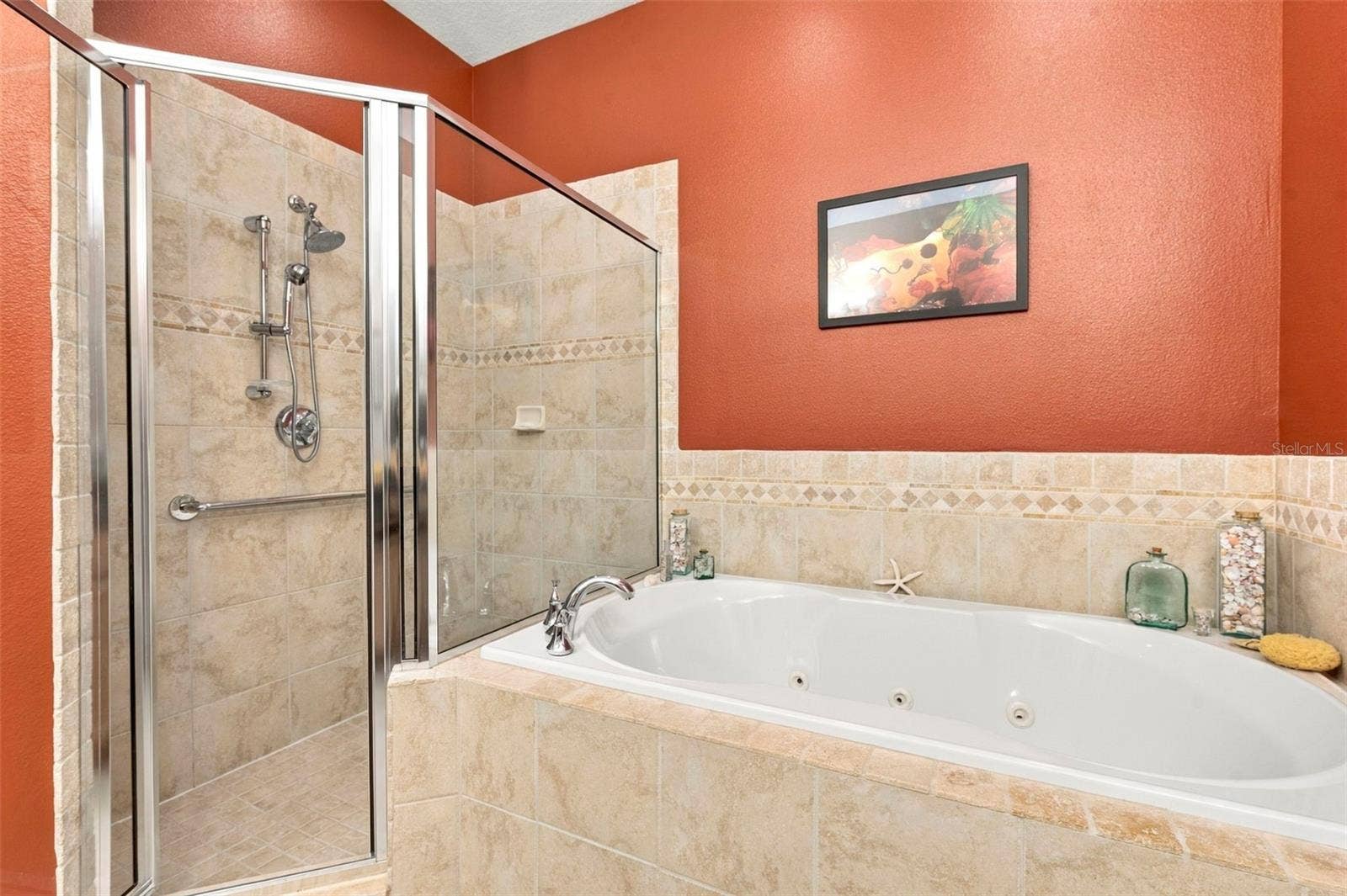Primary Bedroom with En-Suite Bathroom, His & Her Walk-in Closets, Double sinks with Granite countertops, jacuzzi tub, separate shower