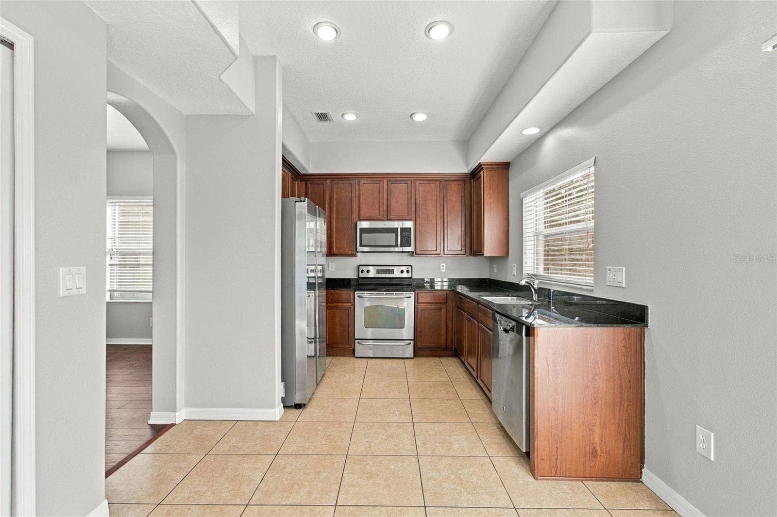 525 POWDER VIEW DRIVE, Ruskin, FL 33570 From Dining Room to Kitchen with window view to backyard to water view
