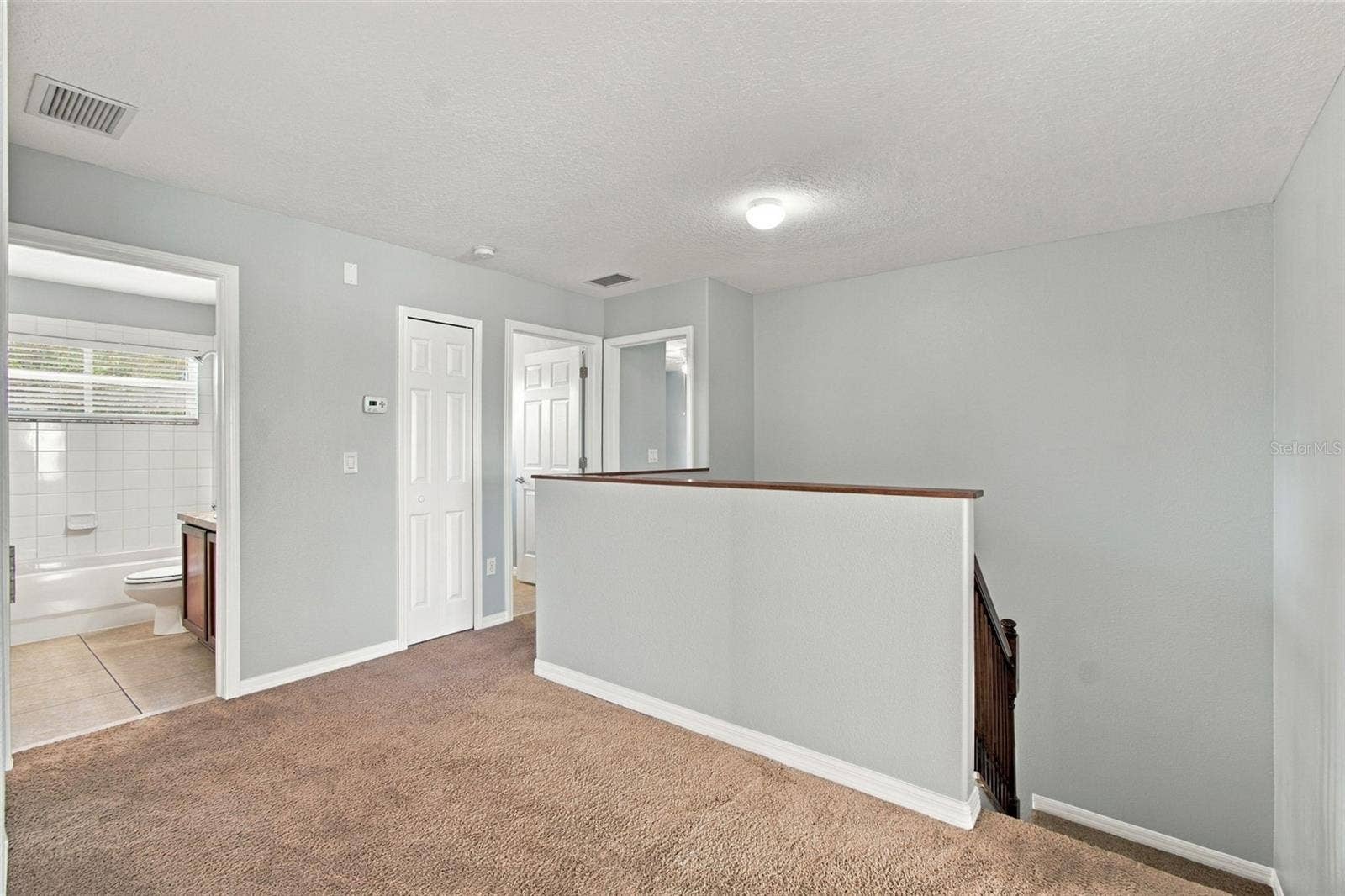 525 POWDER VIEW DRIVE, Ruskin, FL 33570 Upstairs Hallway to Hall Bath and Linen ZCloset