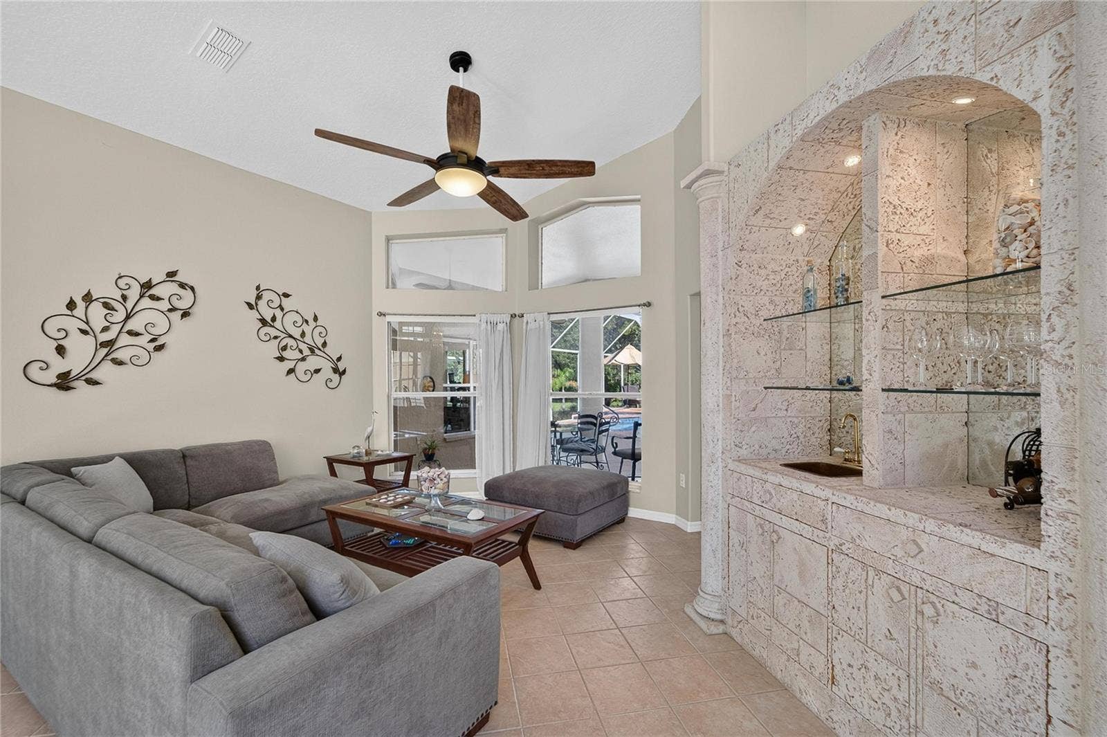 0 OLCOTT DRIVE, Wesley Chapel, FL 33544 Formal living room looks over the pool