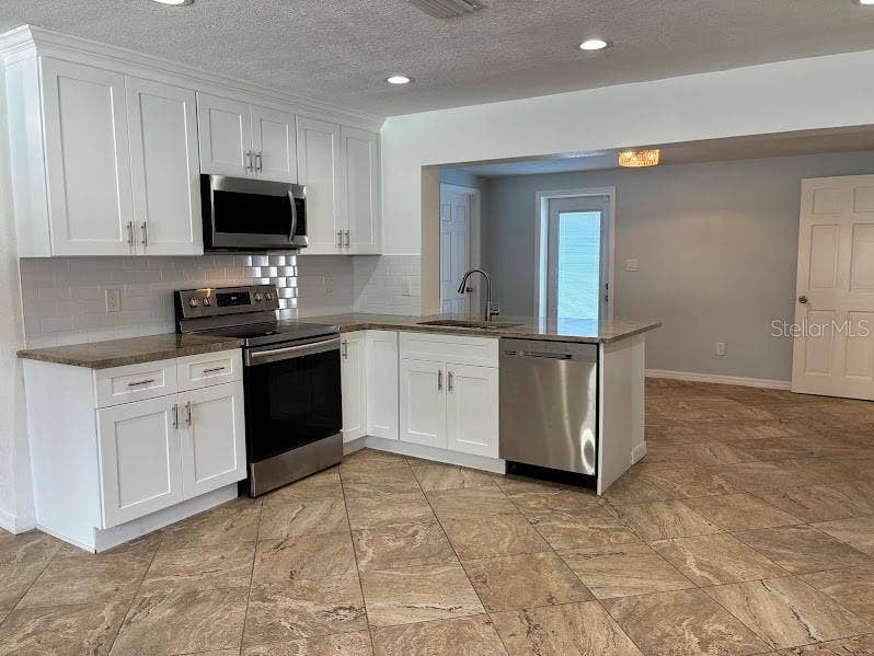 52 CYPRESS DRIVE, Palm Harbor, FL 34684 kitchen with spacious adjacent room