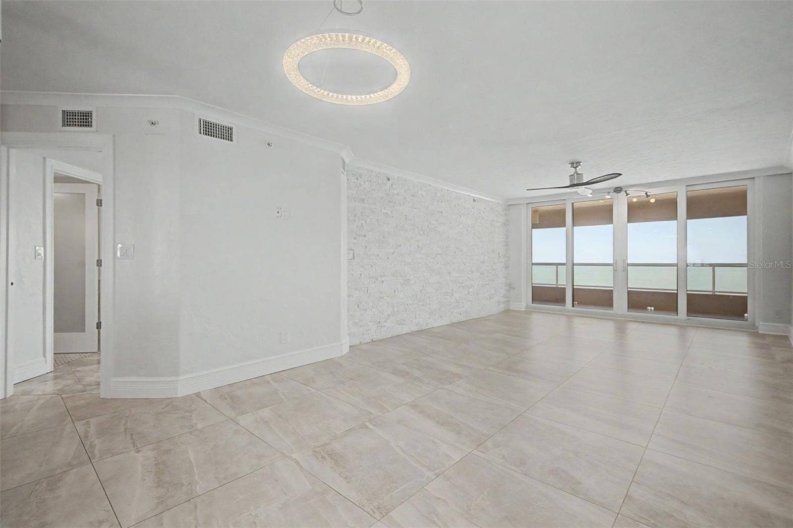 Large Living / Great room with Sliders leading to the Gulf front Balcony