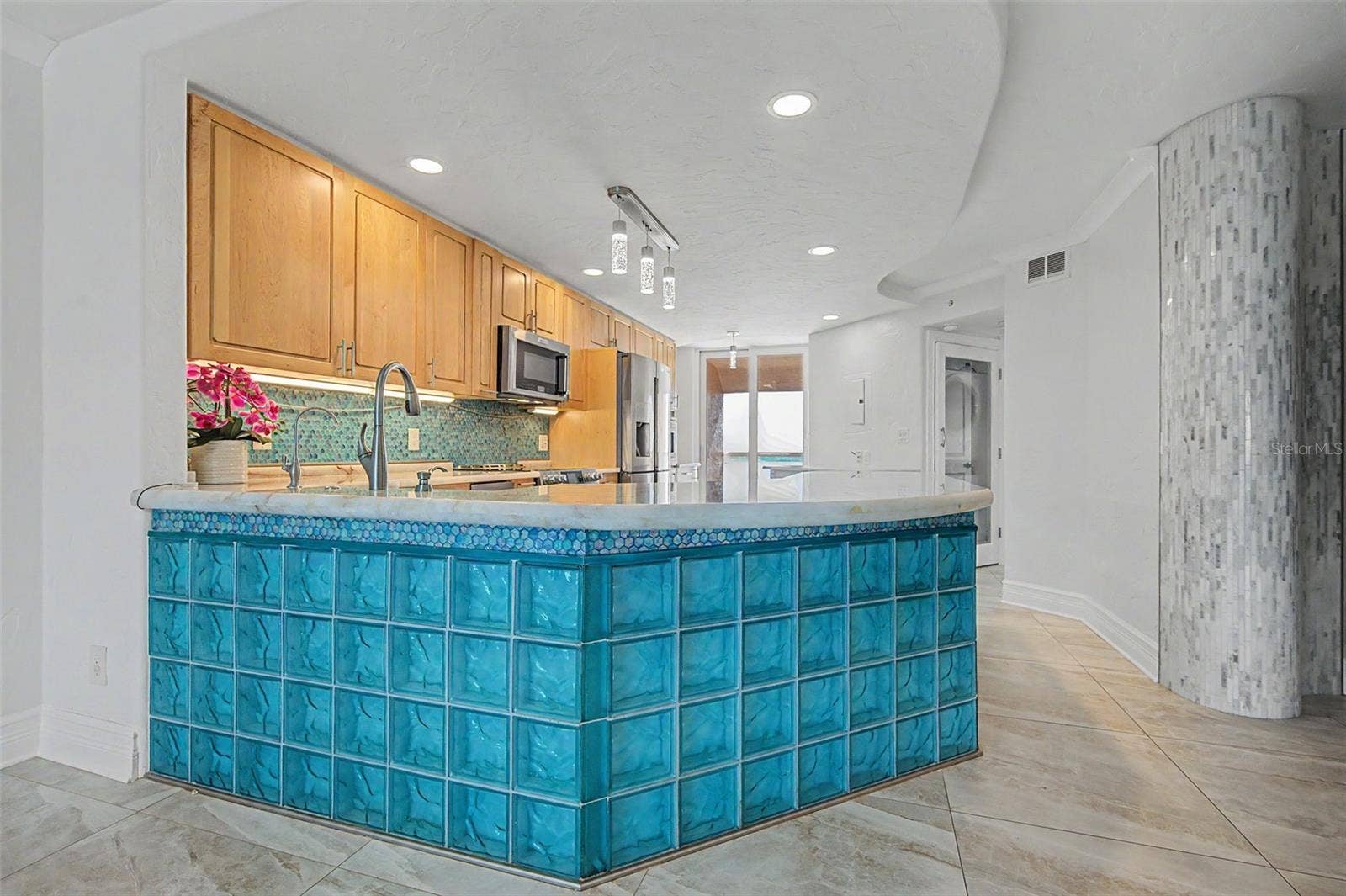 The Contemporary Kitchen with glassed breakfast bar!