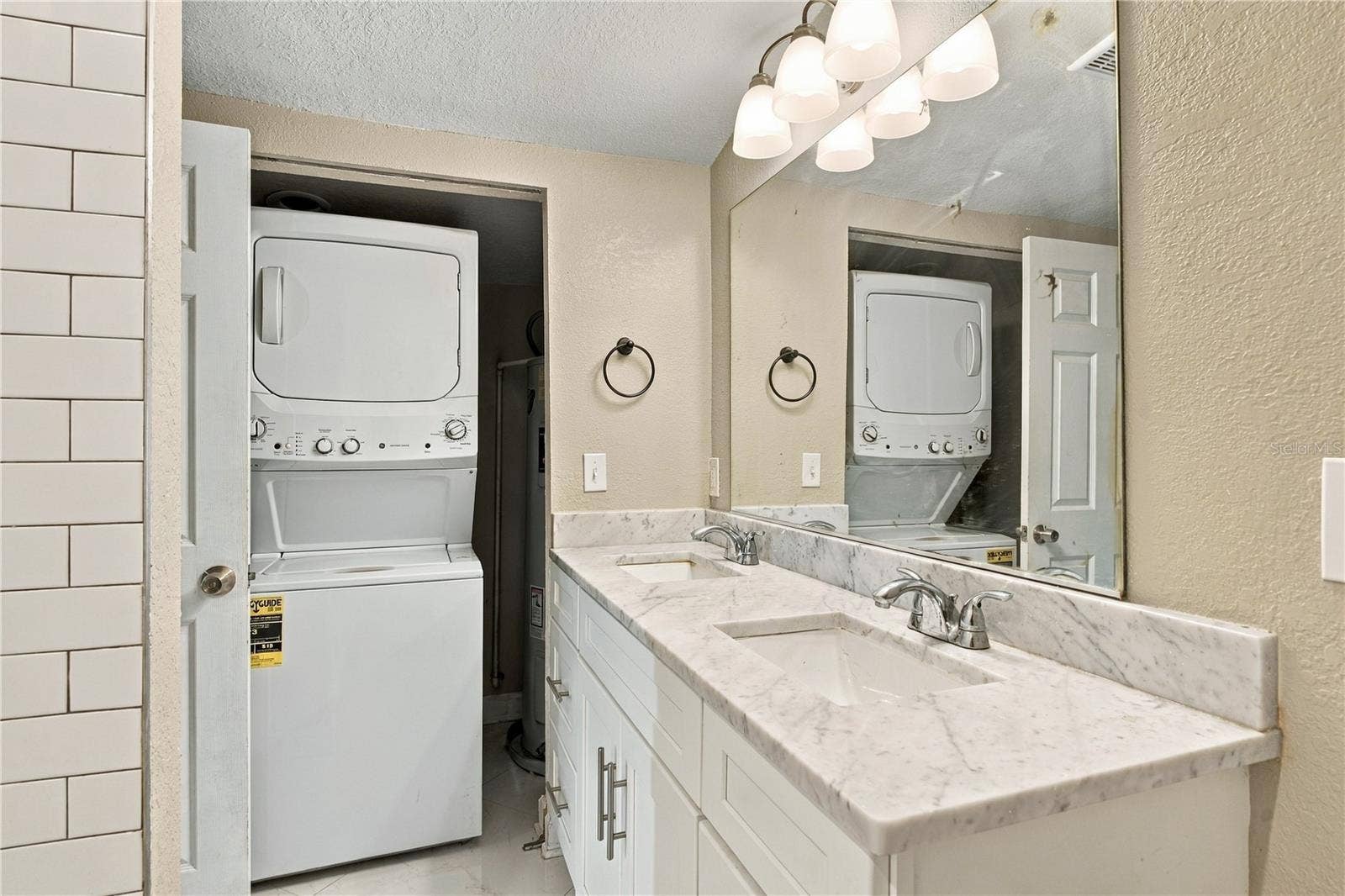 Ensuite with double vanity and laundry area