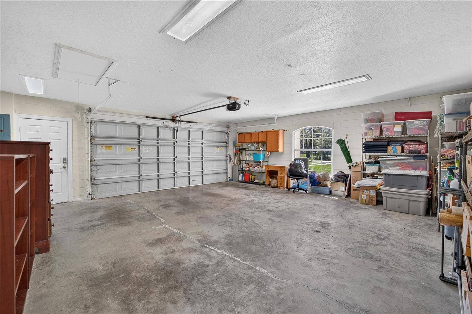 0 LINDENHURST DRIVE, Wesley Chapel, FL 33544 Garage has automatic Cat 3 door with outside access