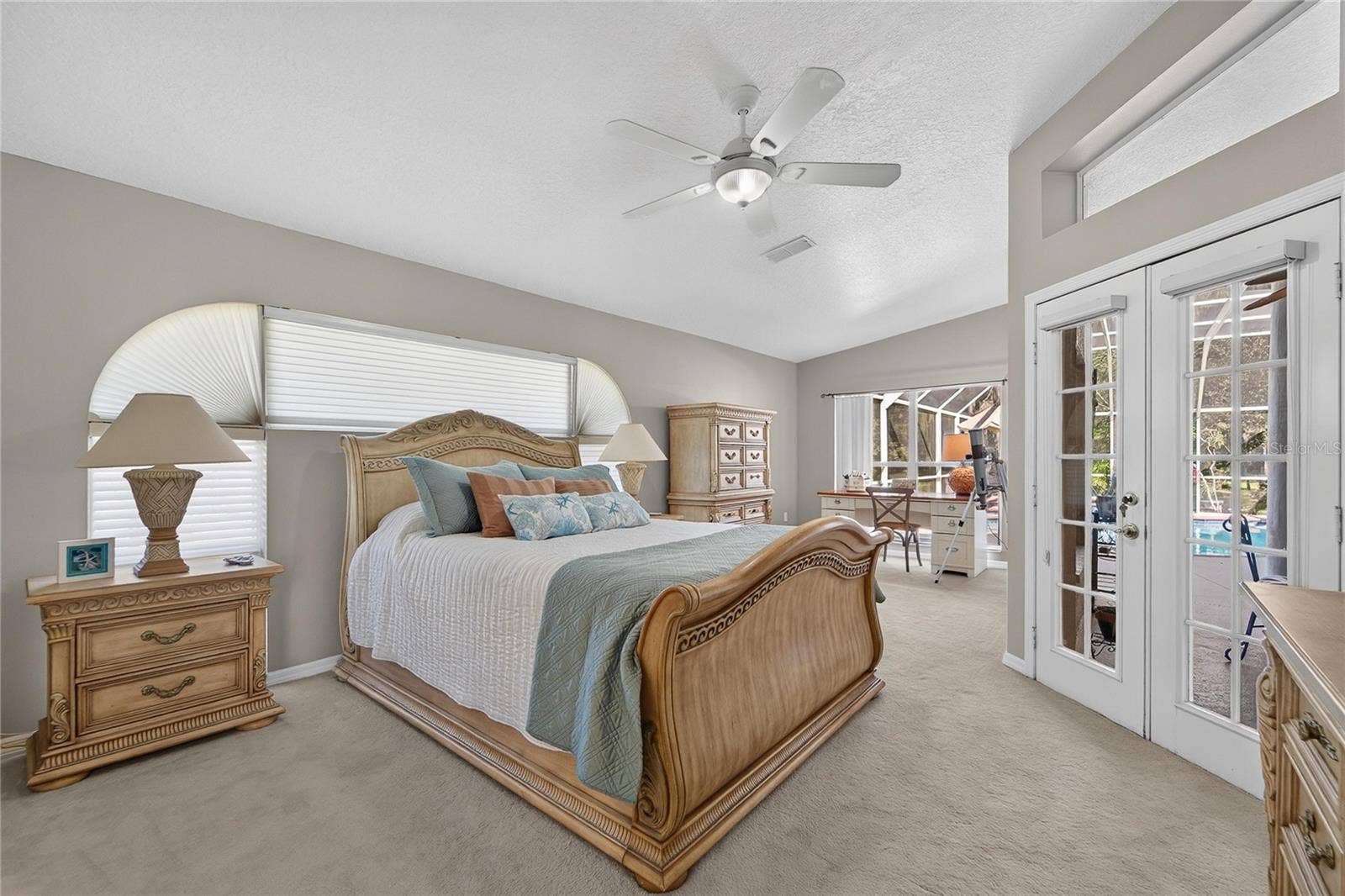 0 LINDENHURST DRIVE, Wesley Chapel, FL 33544 Primary bedroom has French doors to the pool