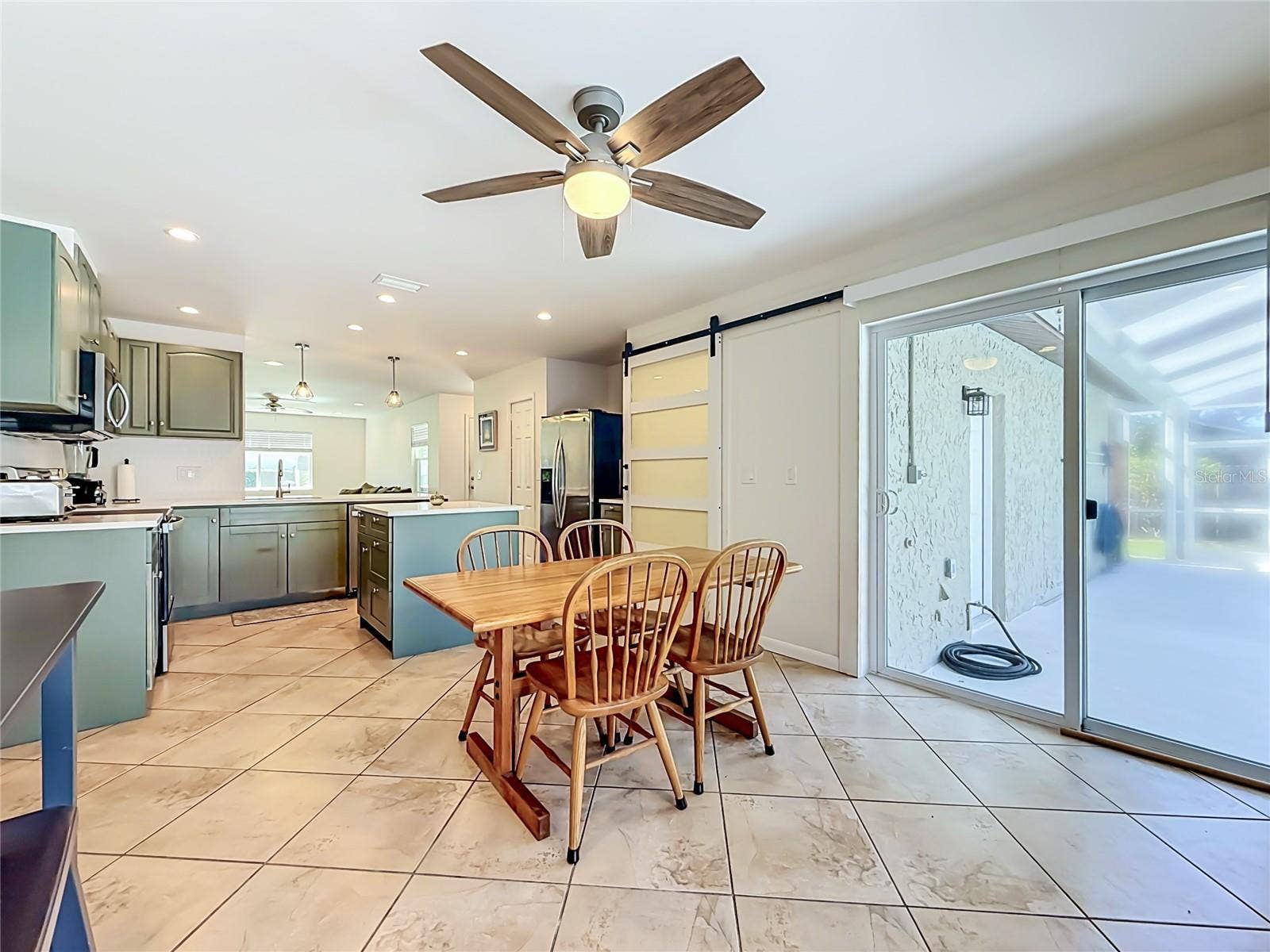 1852 SOURWOOD BOULEVARD, Dunedin, FL 34698 Dining Room - Kitchen