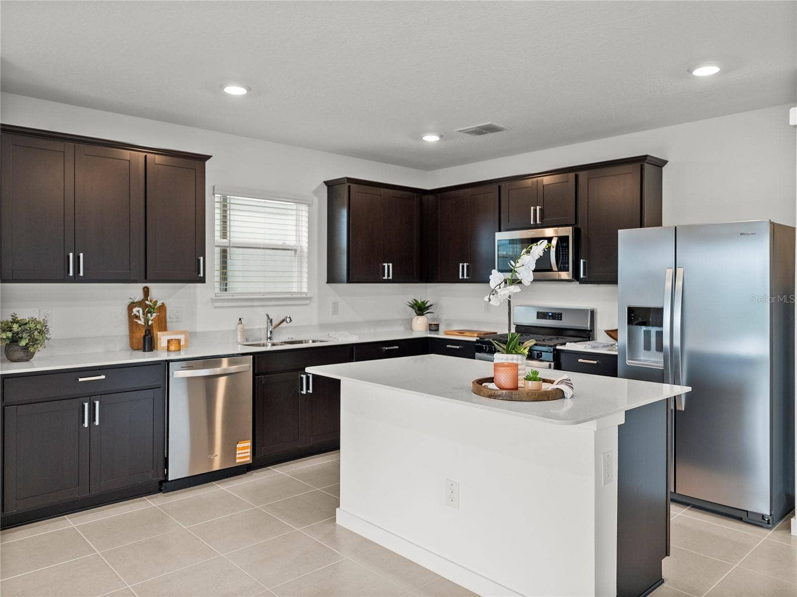 1076 KISTNA DRIVE, Zephyrhills, FL 33540 Kitchen with all New Stainless Steel Appliances, Quartz Countertops & New Hardware