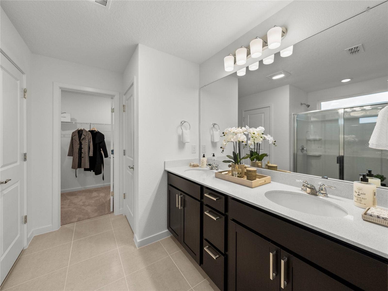 1076 KISTNA DRIVE, Zephyrhills, FL 33540 Primary Bath with Quartz Countertops, Extended Vanity w/Drawers, Large Walk in Linen Closet & Walk in Closet & Toilet Room