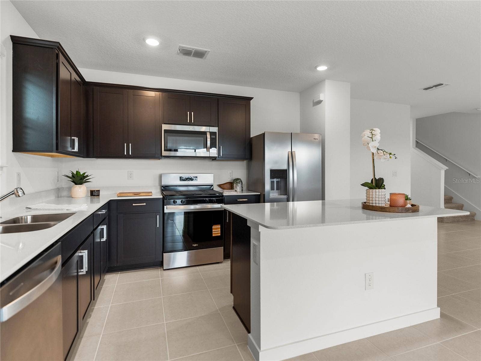 1076 KISTNA DRIVE, Zephyrhills, FL 33540 Kitchen with Vented Microwave to the outside