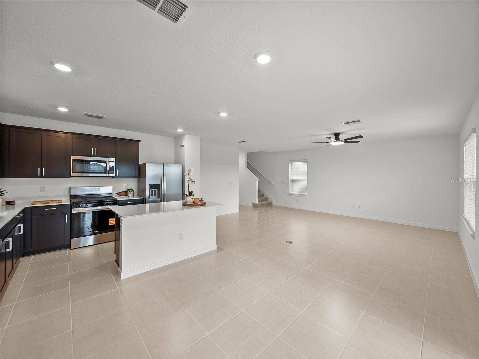 1076 KISTNA DRIVE, Zephyrhills, FL 33540 Open Main Living/Dining and Kitchen Area