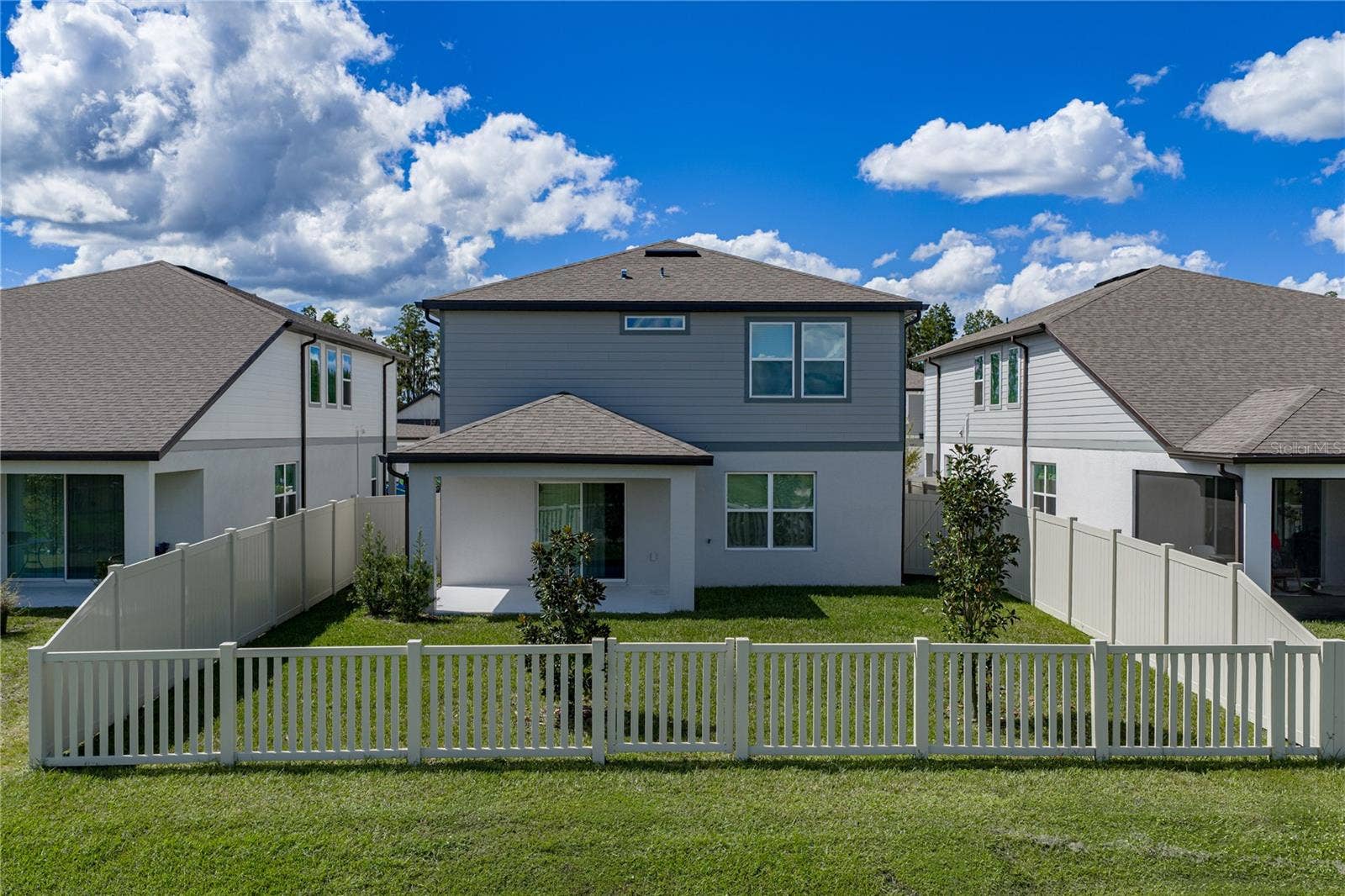 1076 KISTNA DRIVE, Zephyrhills, FL 33540 Rear View of Home with Large Fully Fenced Backyard