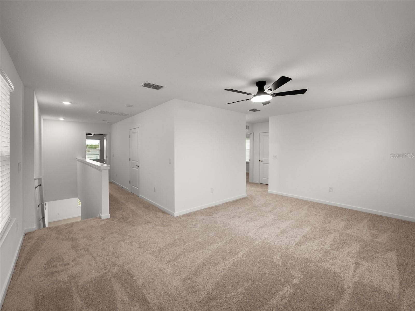 1076 KISTNA DRIVE, Zephyrhills, FL 33540 Large Loft Bonus Room Upstairs with New Ceiling Fan