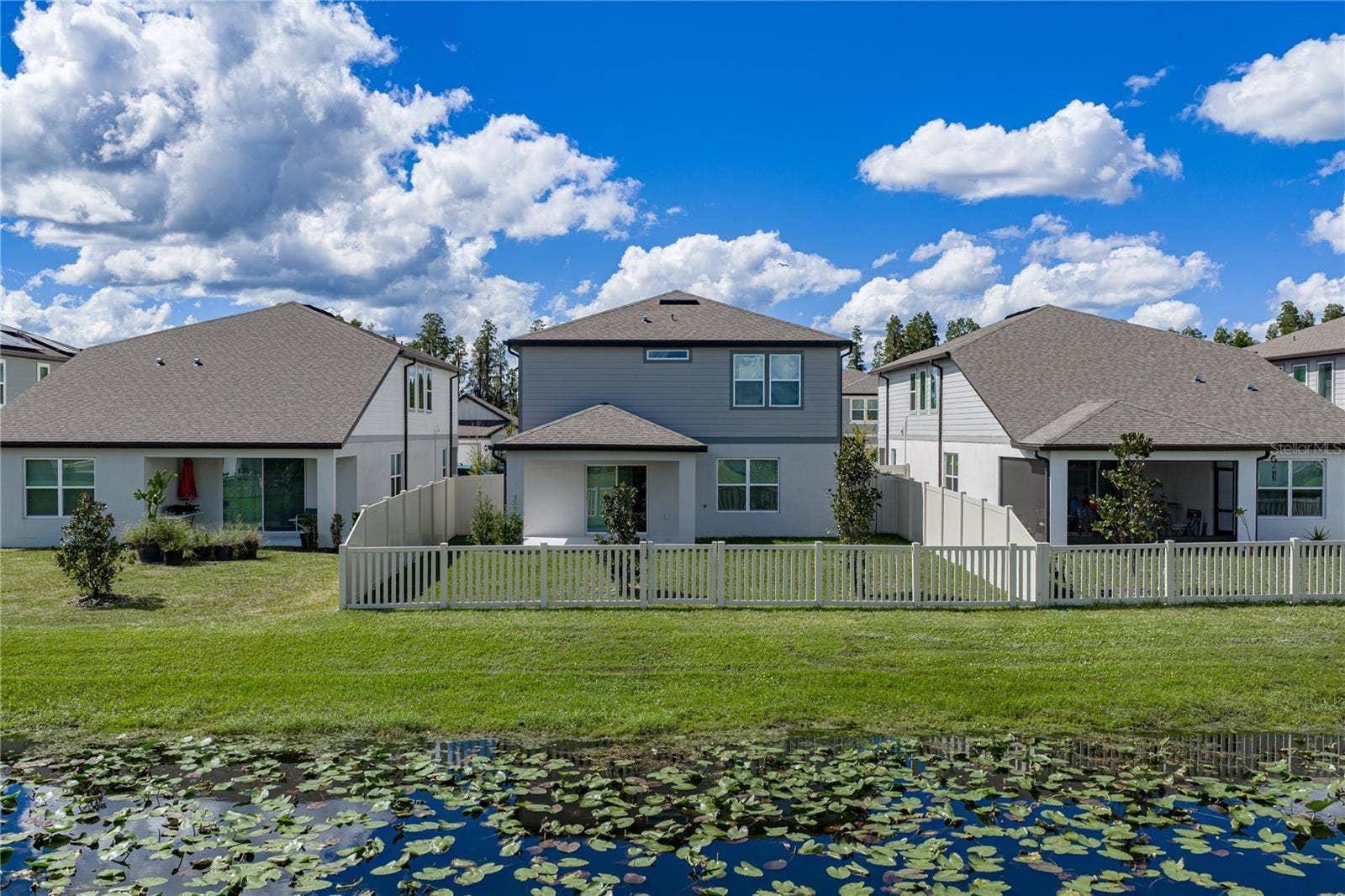 1076 KISTNA DRIVE, Zephyrhills, FL 33540 Fully Fenced Conservation Pond Lot with Covered Lanai