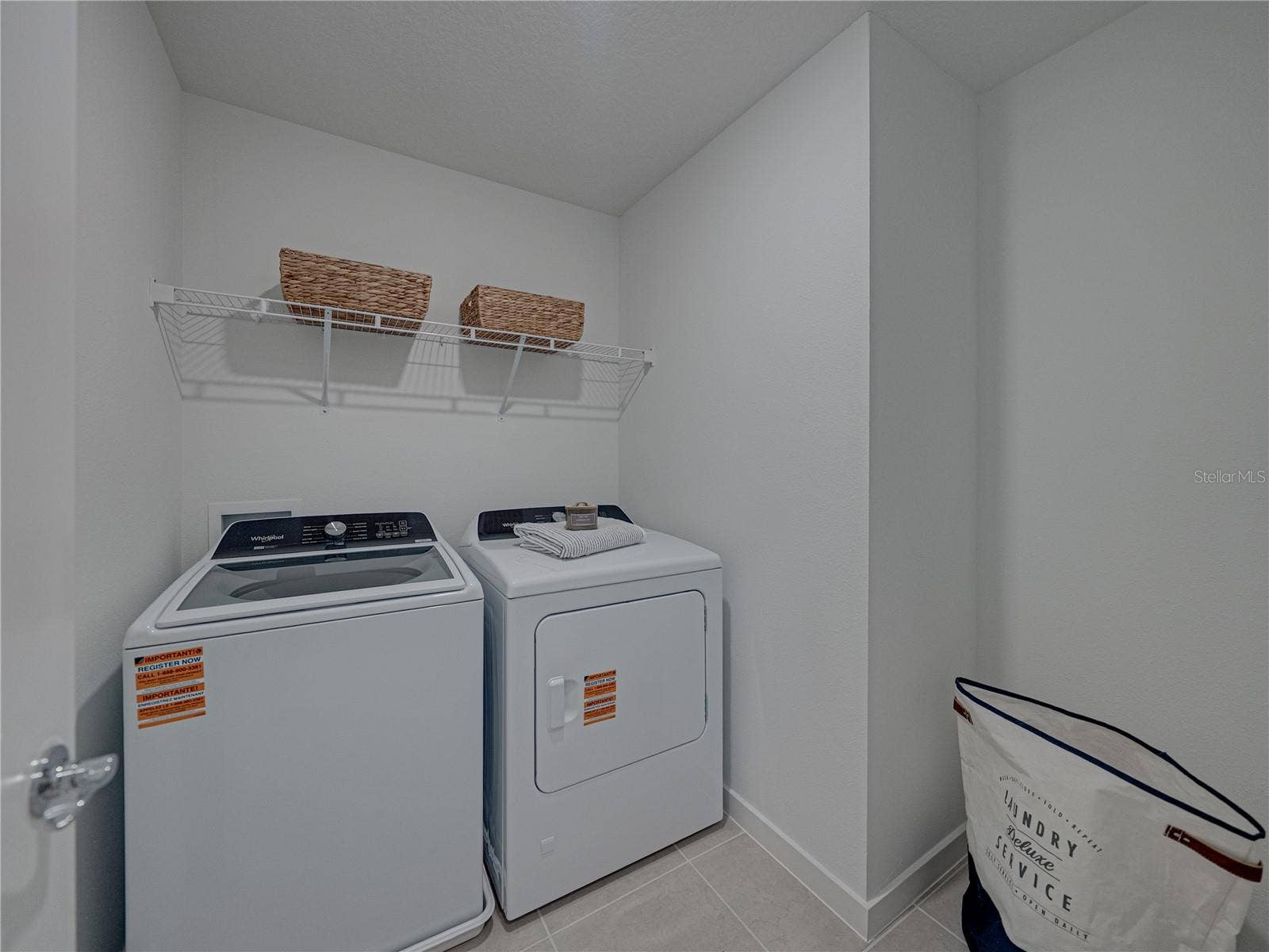 1076 KISTNA DRIVE, Zephyrhills, FL 33540 Large Laundry Room with Storage Shelving and Extra Bump out area