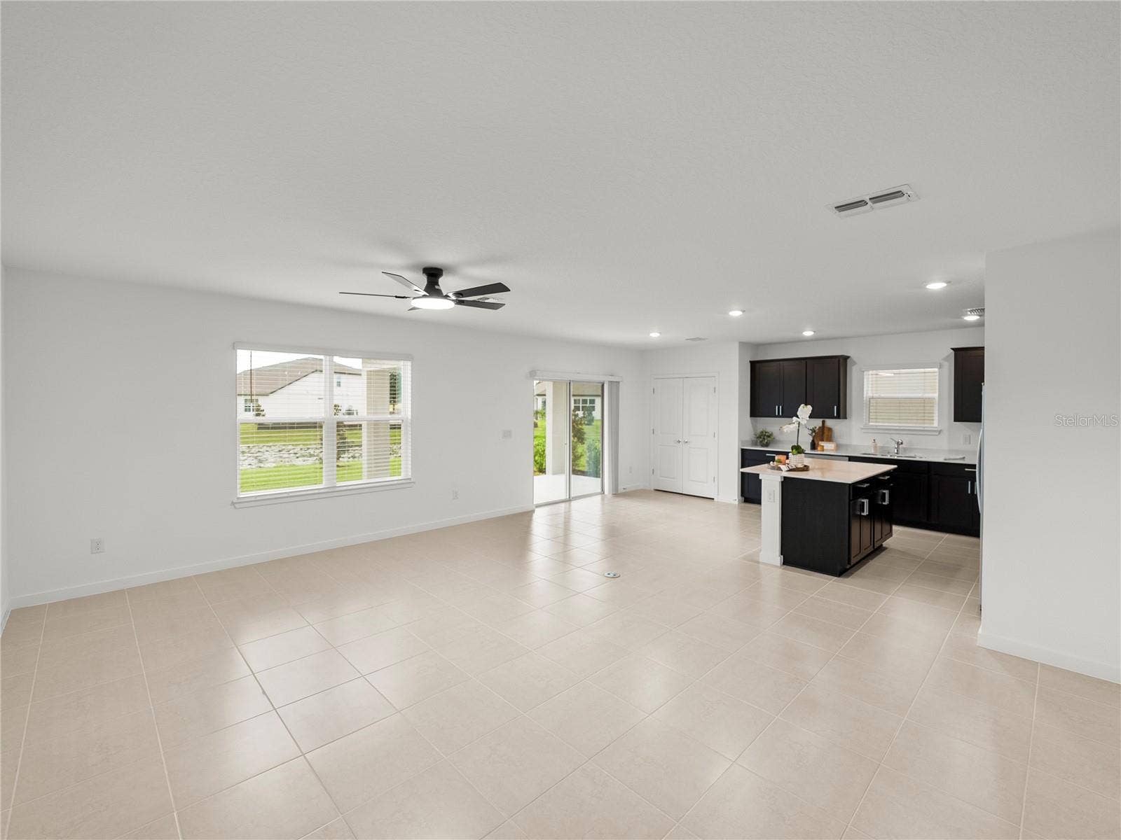 1076 KISTNA DRIVE, Zephyrhills, FL 33540 Main Living/Dining and Kitchen Area all Views to Conservation and Pond