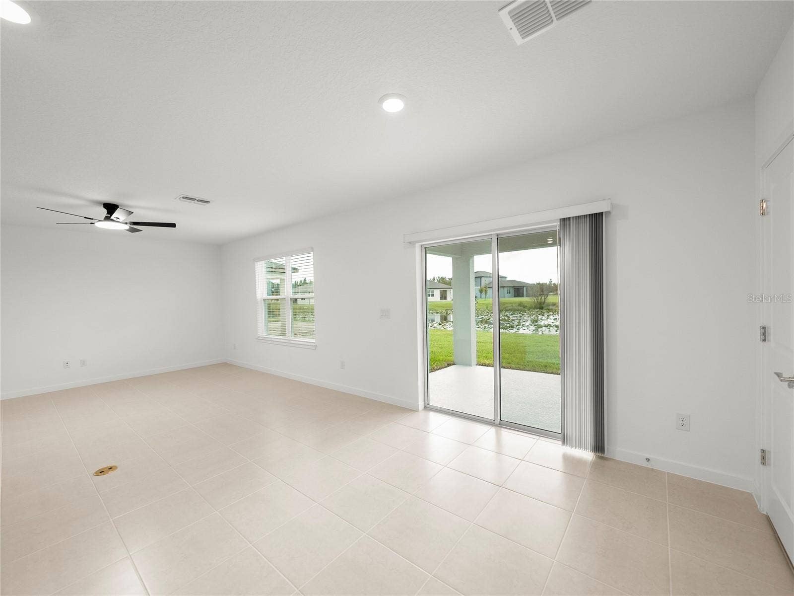 1076 KISTNA DRIVE, Zephyrhills, FL 33540 Amazing Views to Covered Lanai and Pond View Fully Fenced Backyard