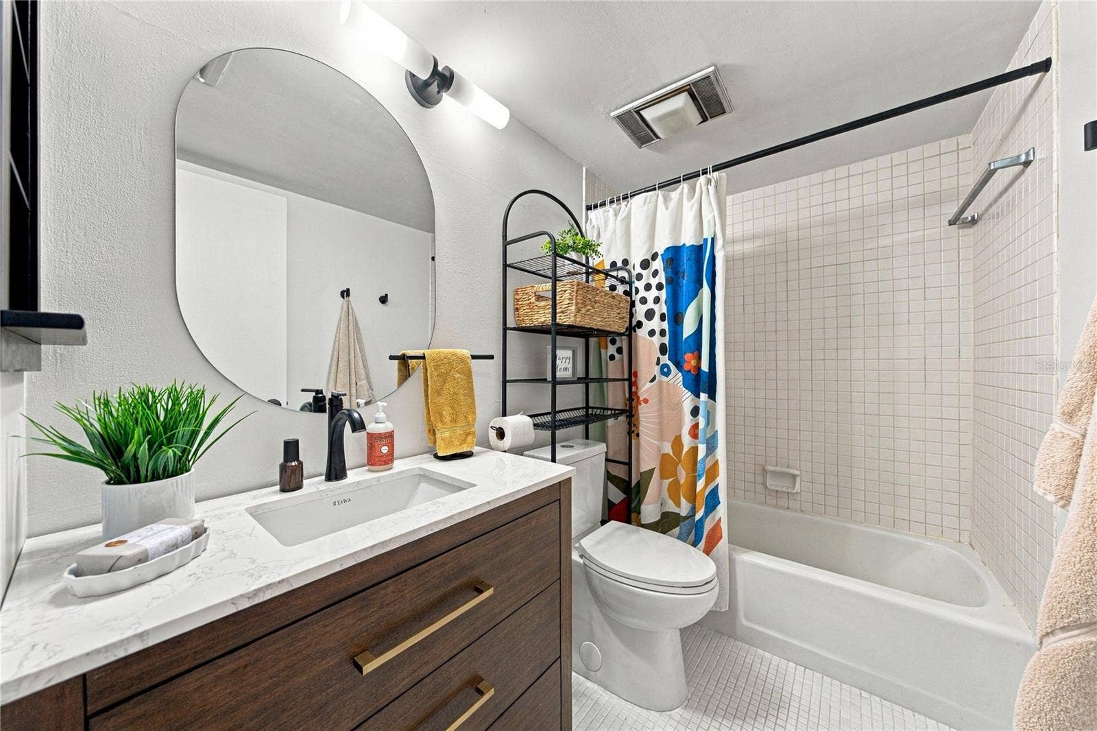Remodeled Second Bath with Beautiful Vanity and Tub & Shower.