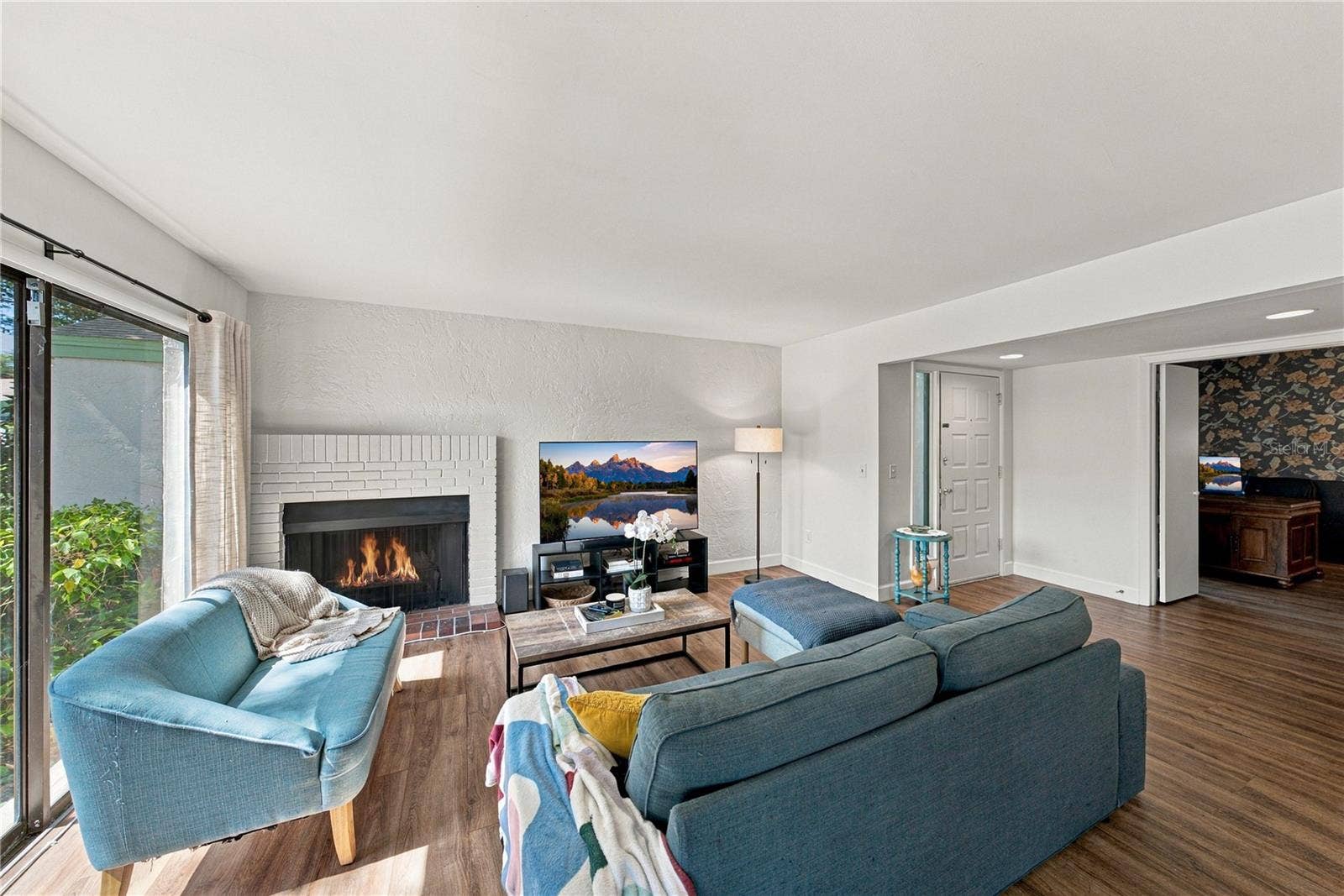 Charming Living Room Area with Beautiful Wood Burning Fireplace