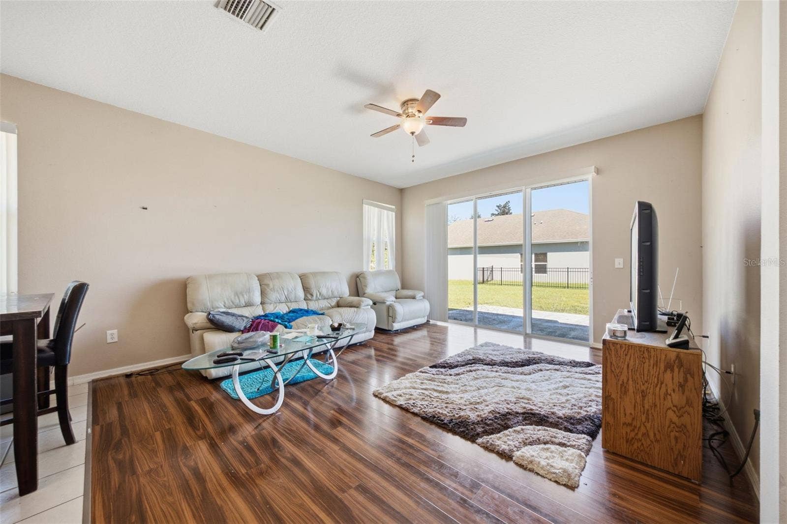 Family room with sliding glass doors to rear patio and yard
