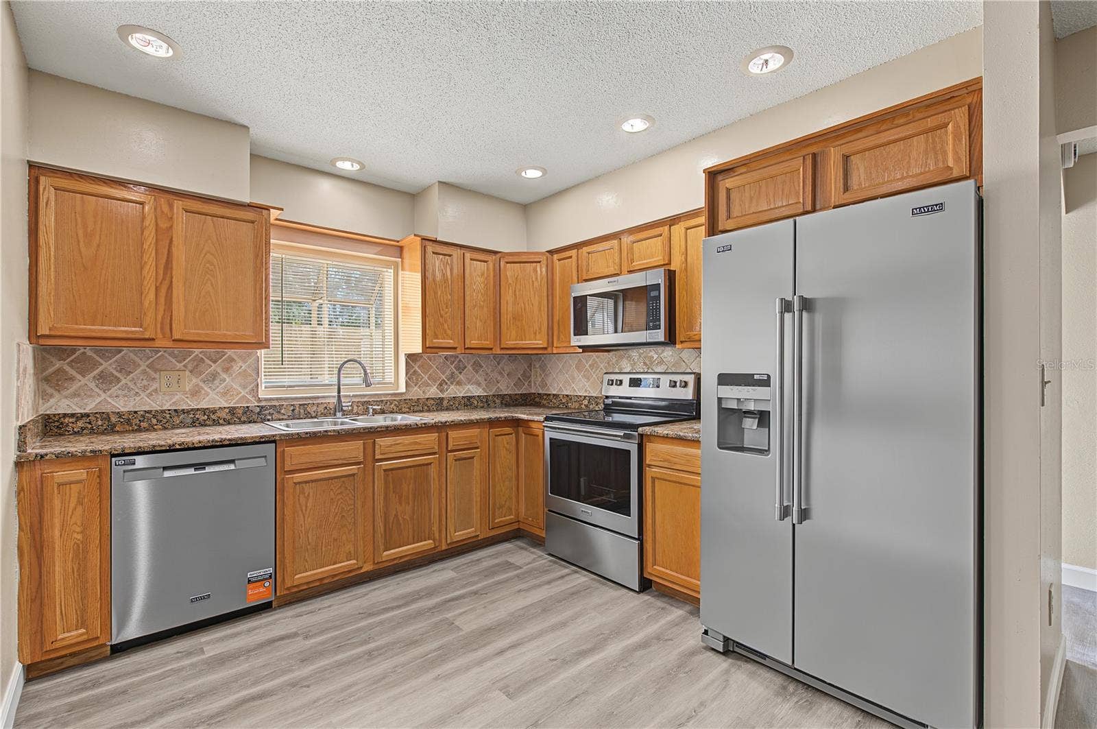 2729 FOXFIRE COURT, #C, Clearwater, FL 33761 Stainless Steel Appliances, Patio off to the side.